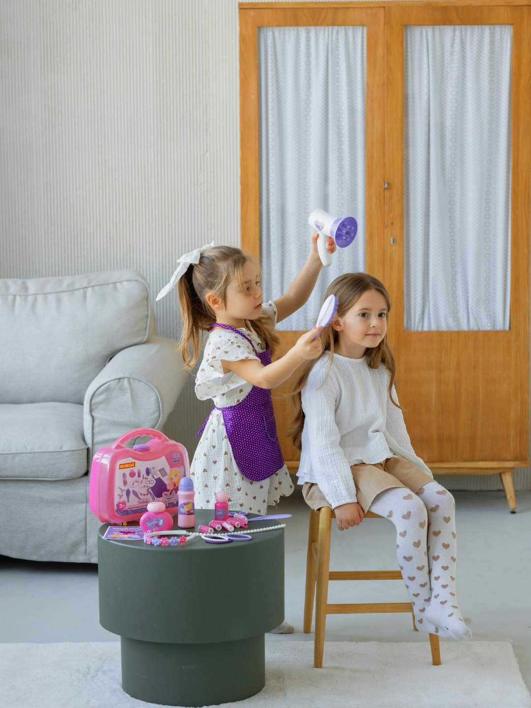 An ABA therapist using shaping to gradually build a new skill with a child, reinforcing each small step closer to the target behaviour during a session