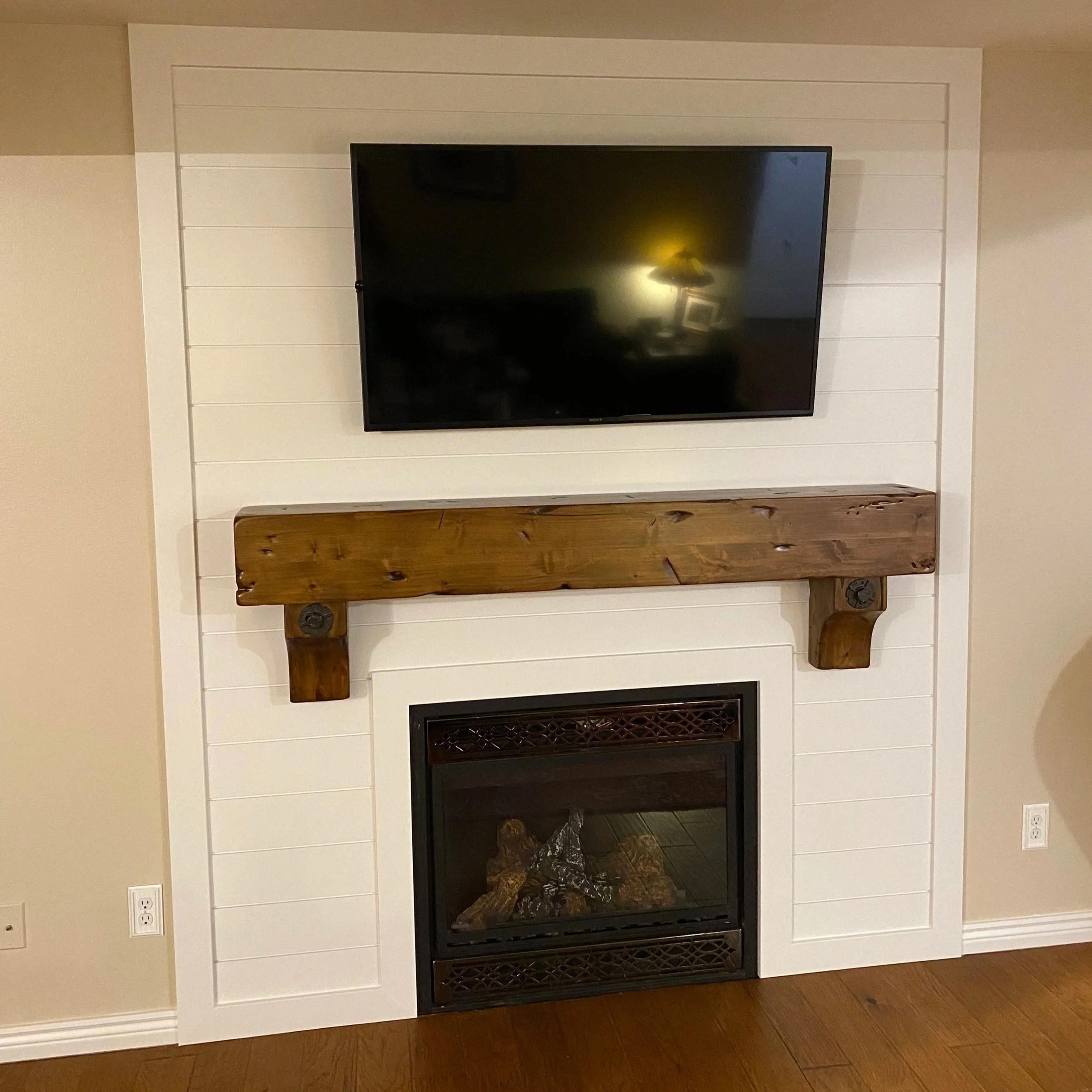 Stunning fireplace feature wall transformation expertly crafted by ANB Construction in Salt Lake and Utah County.