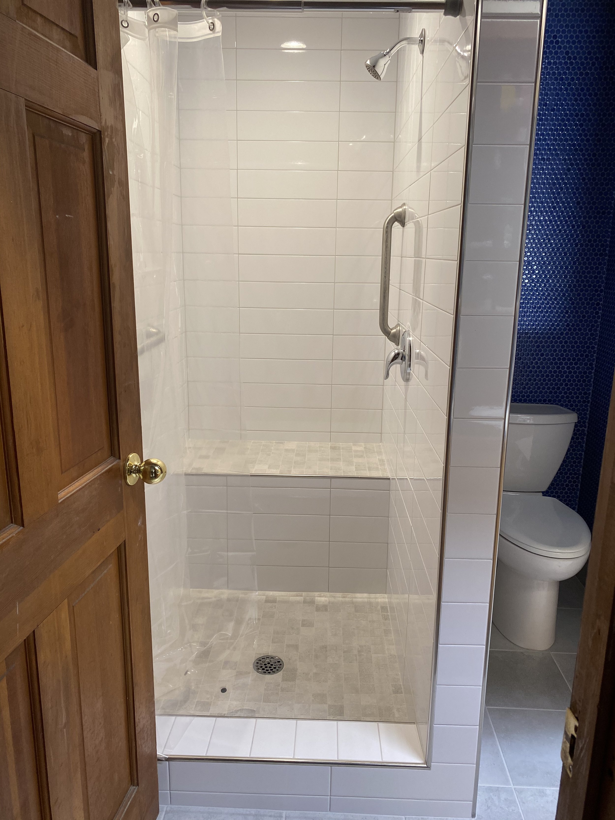 Intricate custom shower tile work with perfect alignment and luxury finishes by ANB Construction.