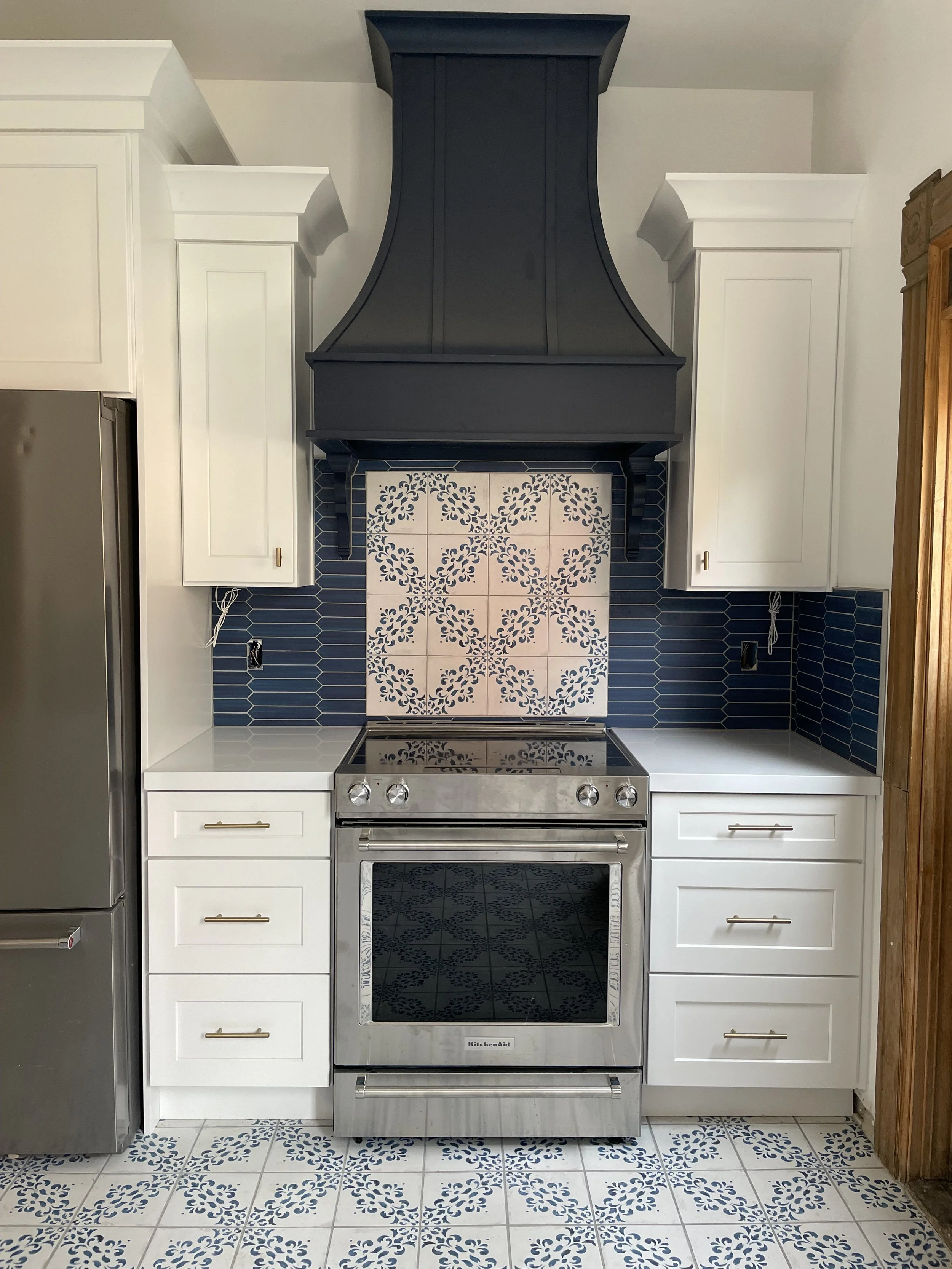 High-end custom tile backsplash showcasing detailed accent work and premium finishes in Salt Lake and Utah County.