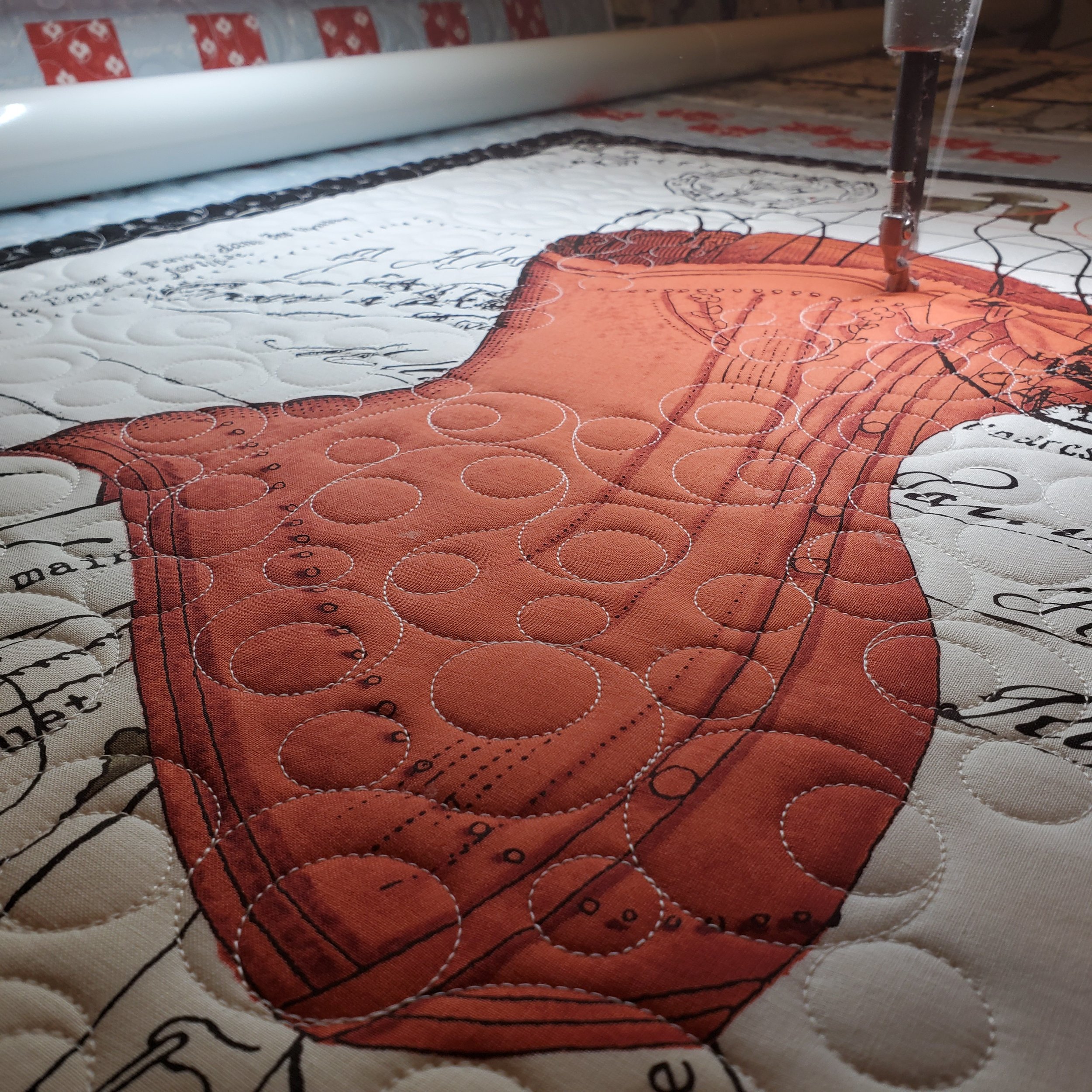 Computer guided quilting sewing machine stitching fabric