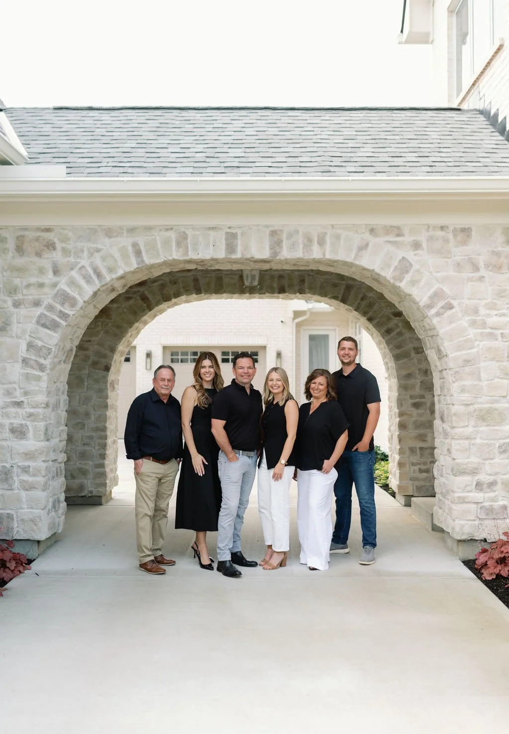 Redknot Custom Homes team smiling outdoors for team photo