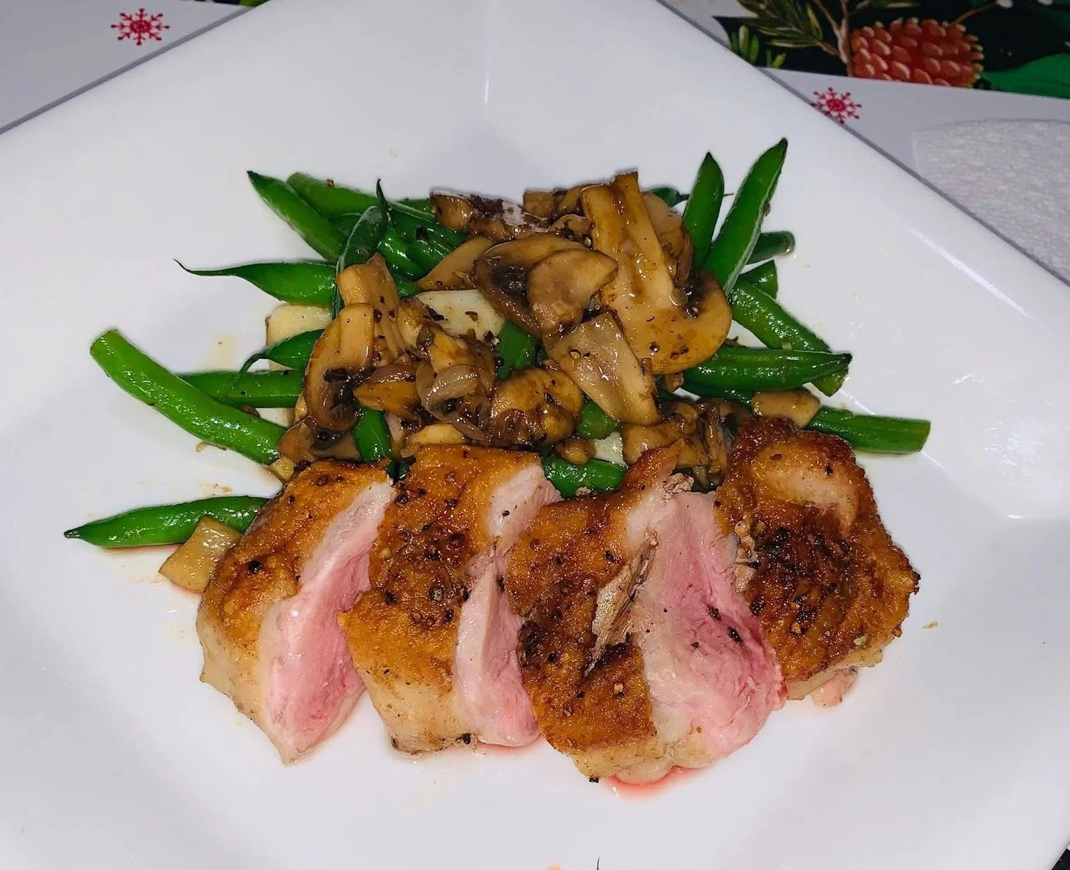 Pan seared duck with duck fat sauteed green beans and mushrooms