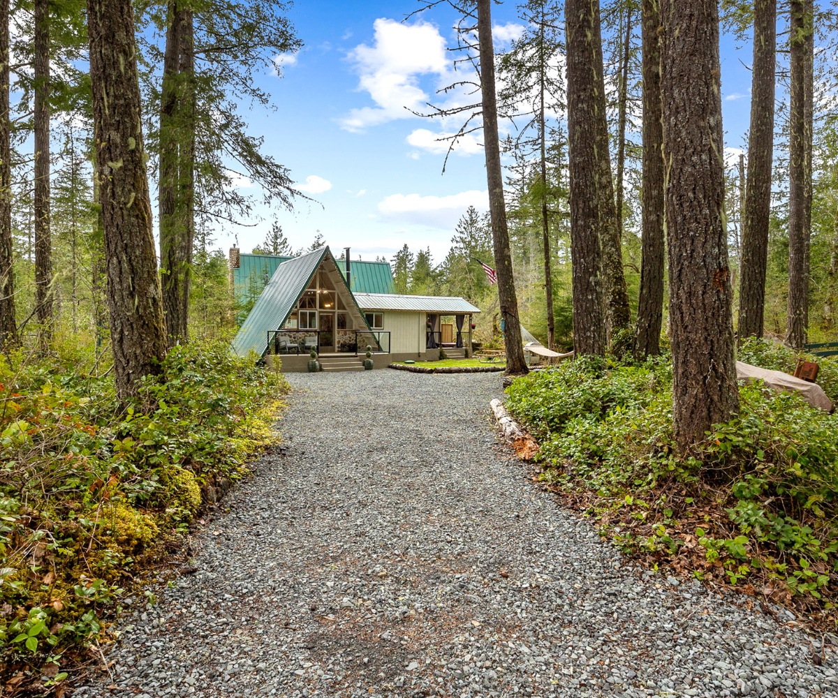 Wooded driveway leading to a cabin property listed by Caitie Henselman in Ashford, Washington near Mount Rainier