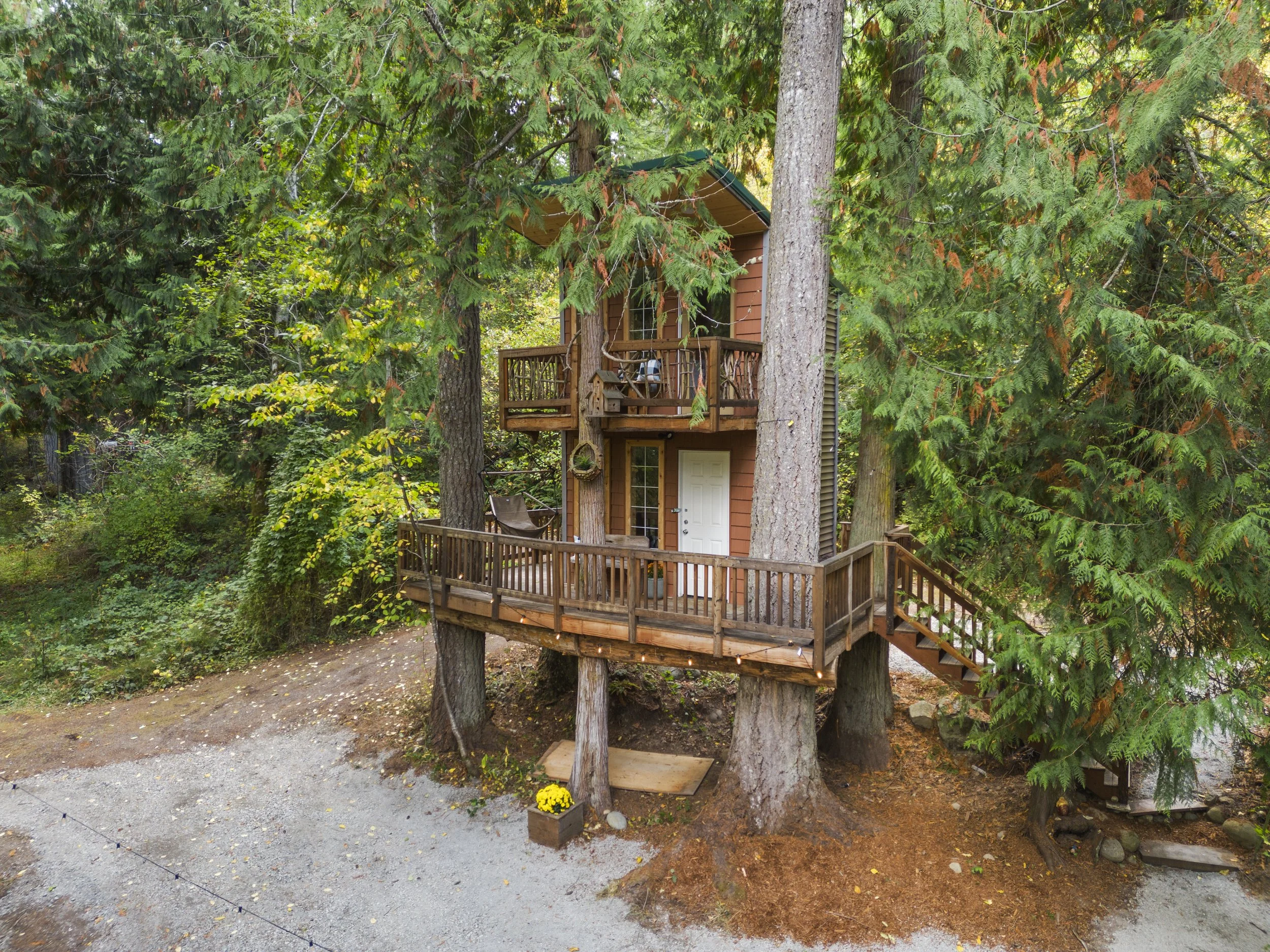 Treehouse on a one-acre riverfront property listed by Caitie Henselman in Rainier, Washington.