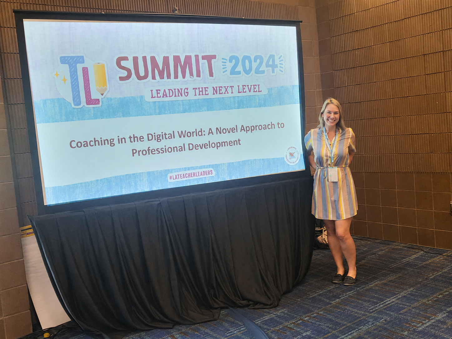 Katy Dyson presenting at Teacher Leader Summit. The presentation topic is 'Coaching in the Digital World: A Novel Approach to Professional Development'.
