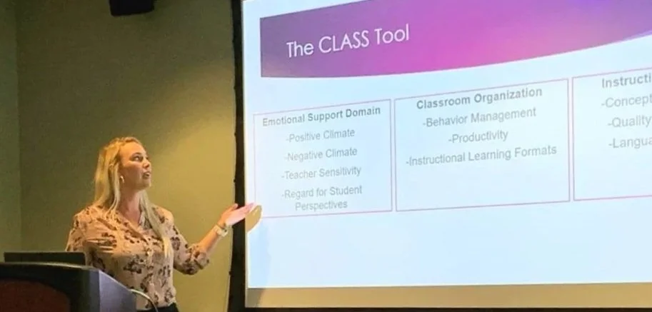 Katy Dyson giving a presentation on  'The CLASS Tool'. The slide includes sections on Emotional Support Domain, Classroom Organization, and Instructional Support, with bullet points under each.