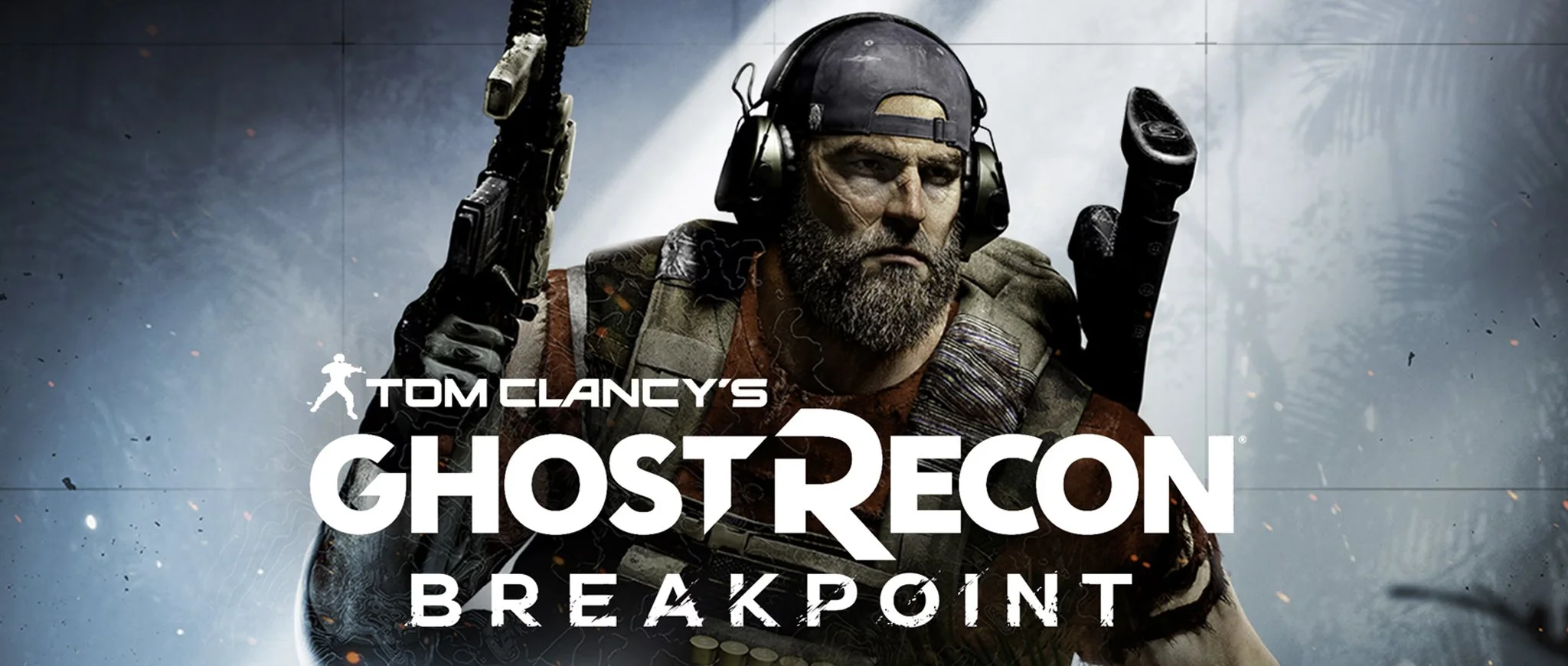 Cover art for the video game Ghost Recon Breakpoint featuring Nomad, a serious commando with a beard, wearing a helmet, tactical gear, and holding a gun, with the title at the bottom.