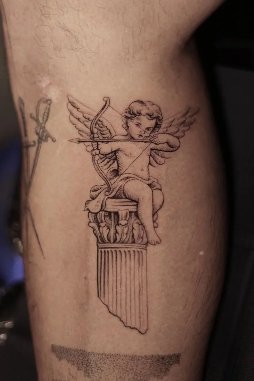 Fine-line Cupid drawing a bow from a classical column tattoo by Luis Dajer.