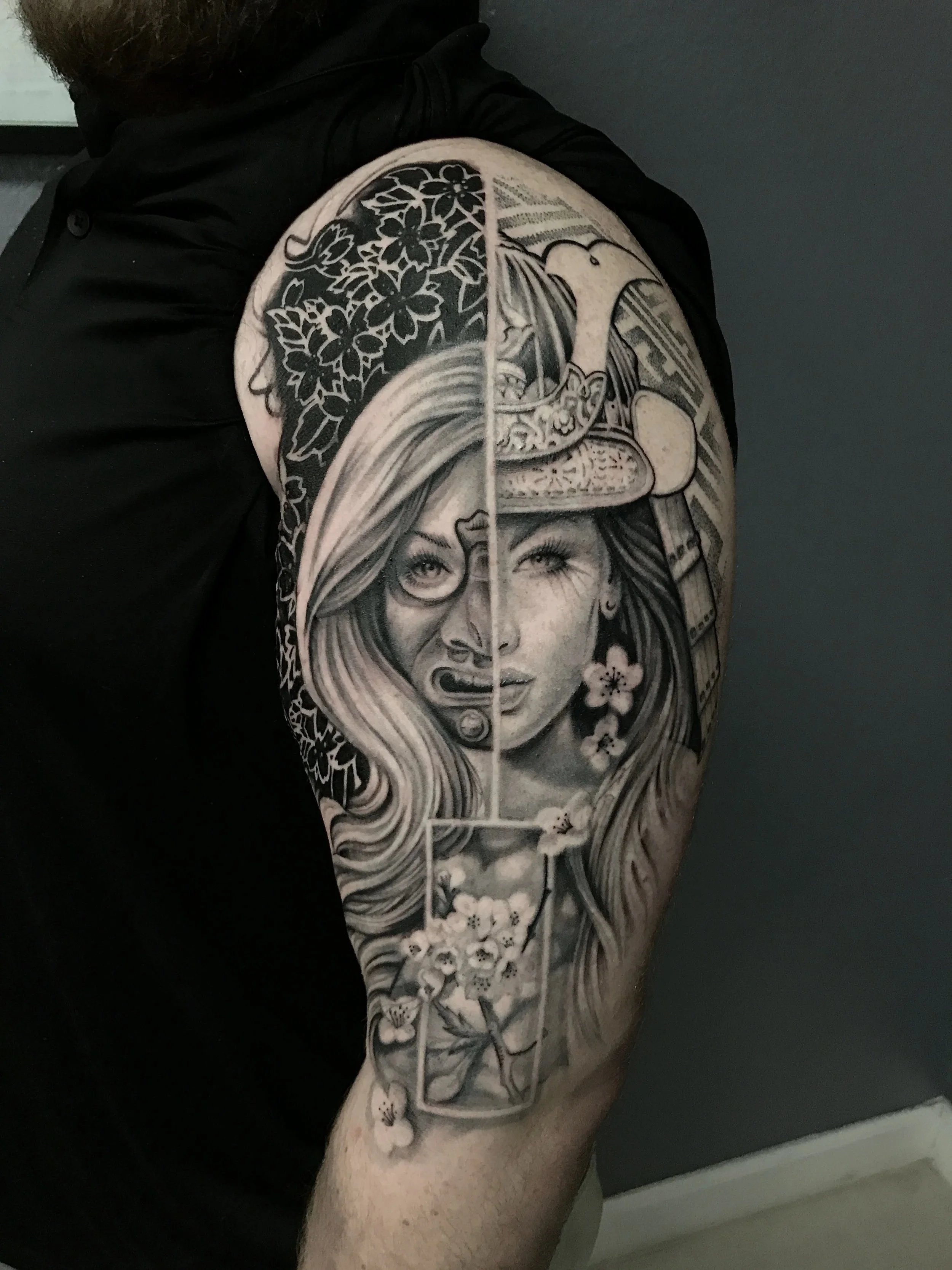 Black-and-gray woman, cherry blossoms and bird sleeve by Luis Dajer in Charlotte, NC.
