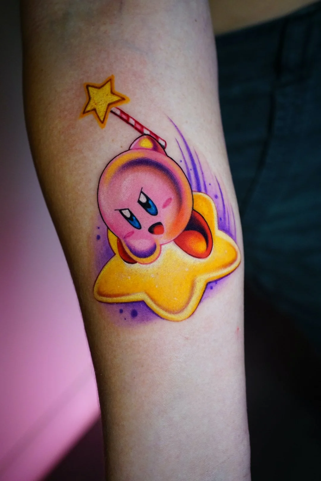 Color Kirby and shooting-star arm tattoo at Black Craft Tattoo Collective.