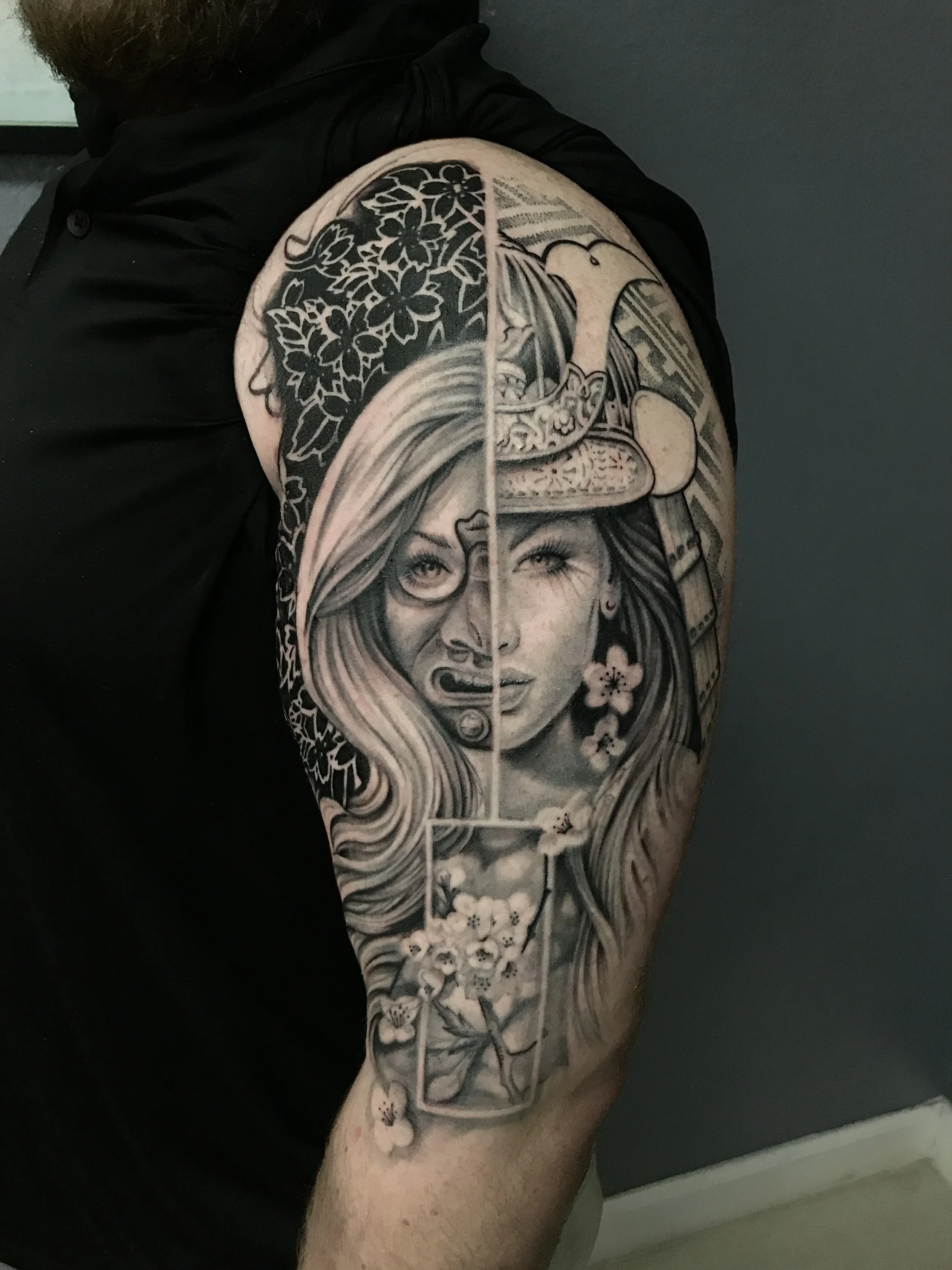 Black-and-gray woman, flowers and mountain full-sleeve tattoo by Luis Dajer in Charlotte, NC.