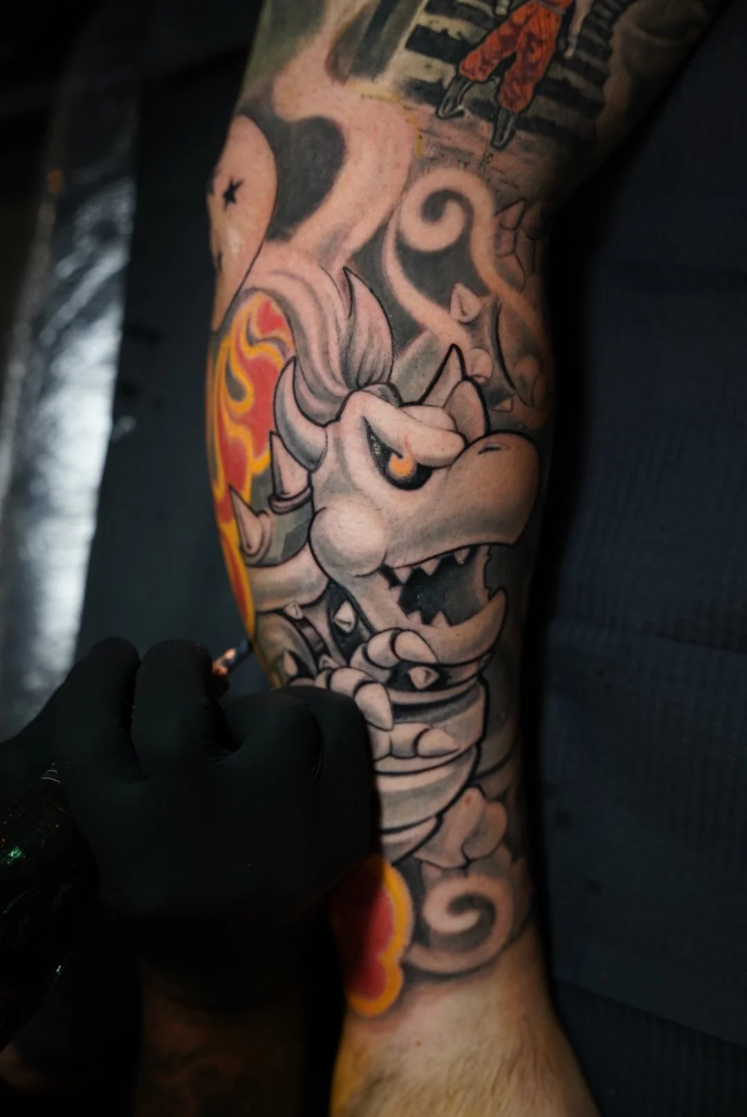Color Bowser tattoo from Super Mario being inked at Black Craft Tattoo Collective.