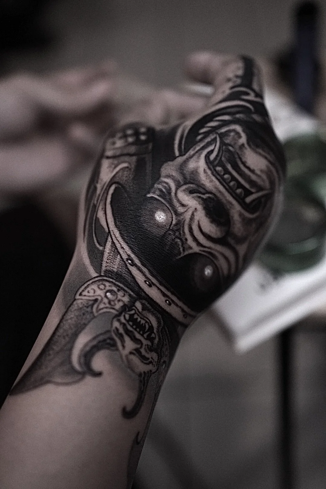 Realistic black-and-gray roaring tiger arm tattoo at Black Craft Tattoo Collective.