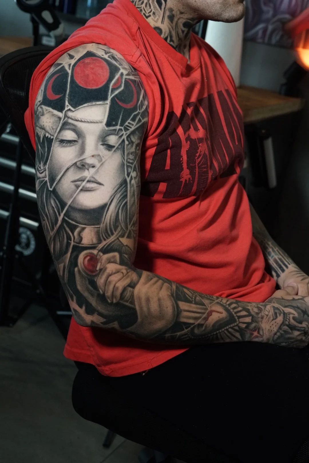 Healed black-and-grey and red fantasy portrait sleeve tattoo by Luis Dajer at Black Craft Tattoo Collective in Charlotte, NC.