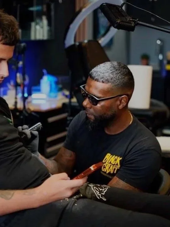 Luis Dajer receiving a tattoo inside Black Craft Tattoo Collective in Charlotte, NC.