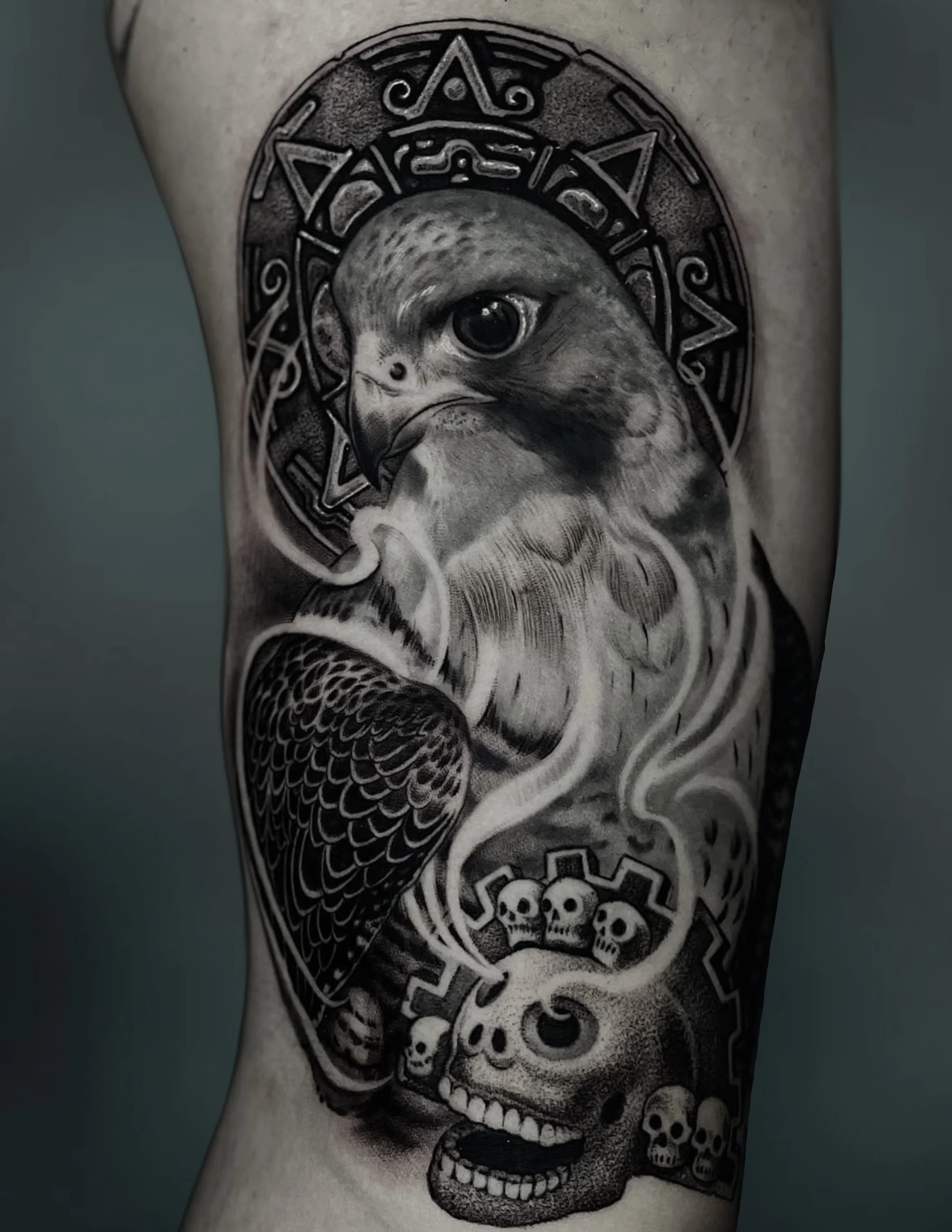 Black-and-gray skull and smoke arm tattoo at Black Craft Tattoo Collective.