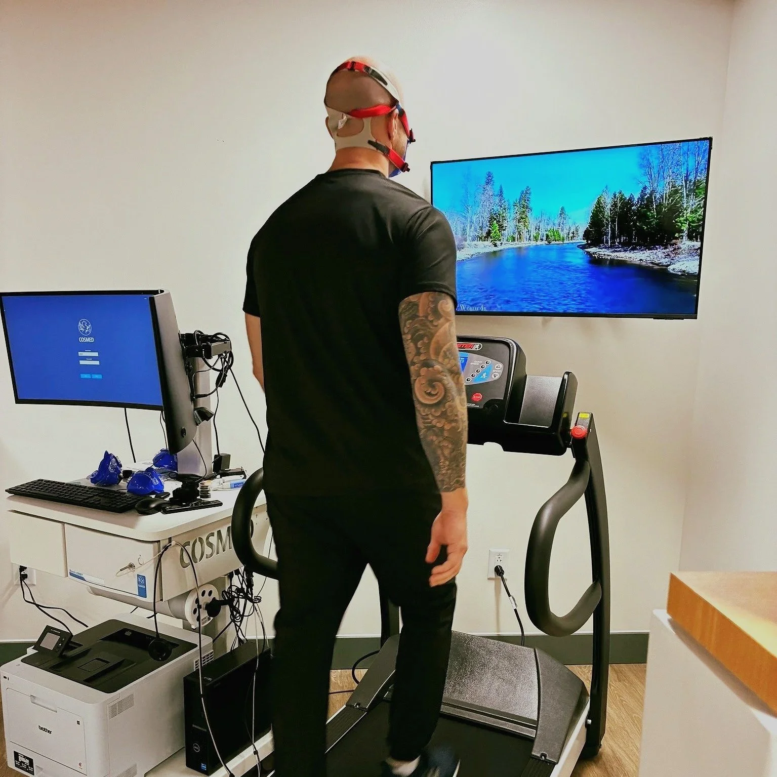 man walking on a treadmill while his metabolic fitness is being tested