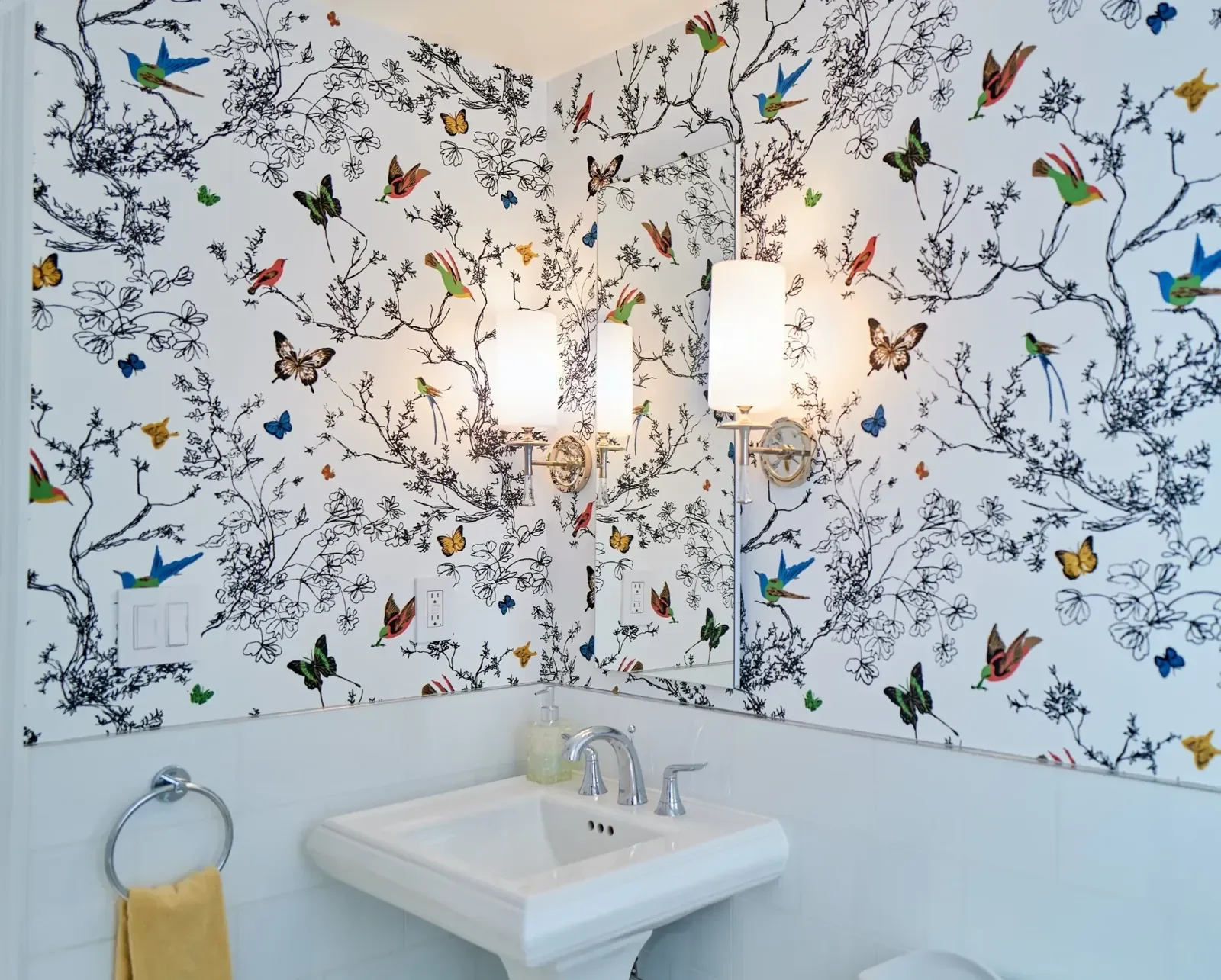 Decorative wallpaper installation in a residential powder room.