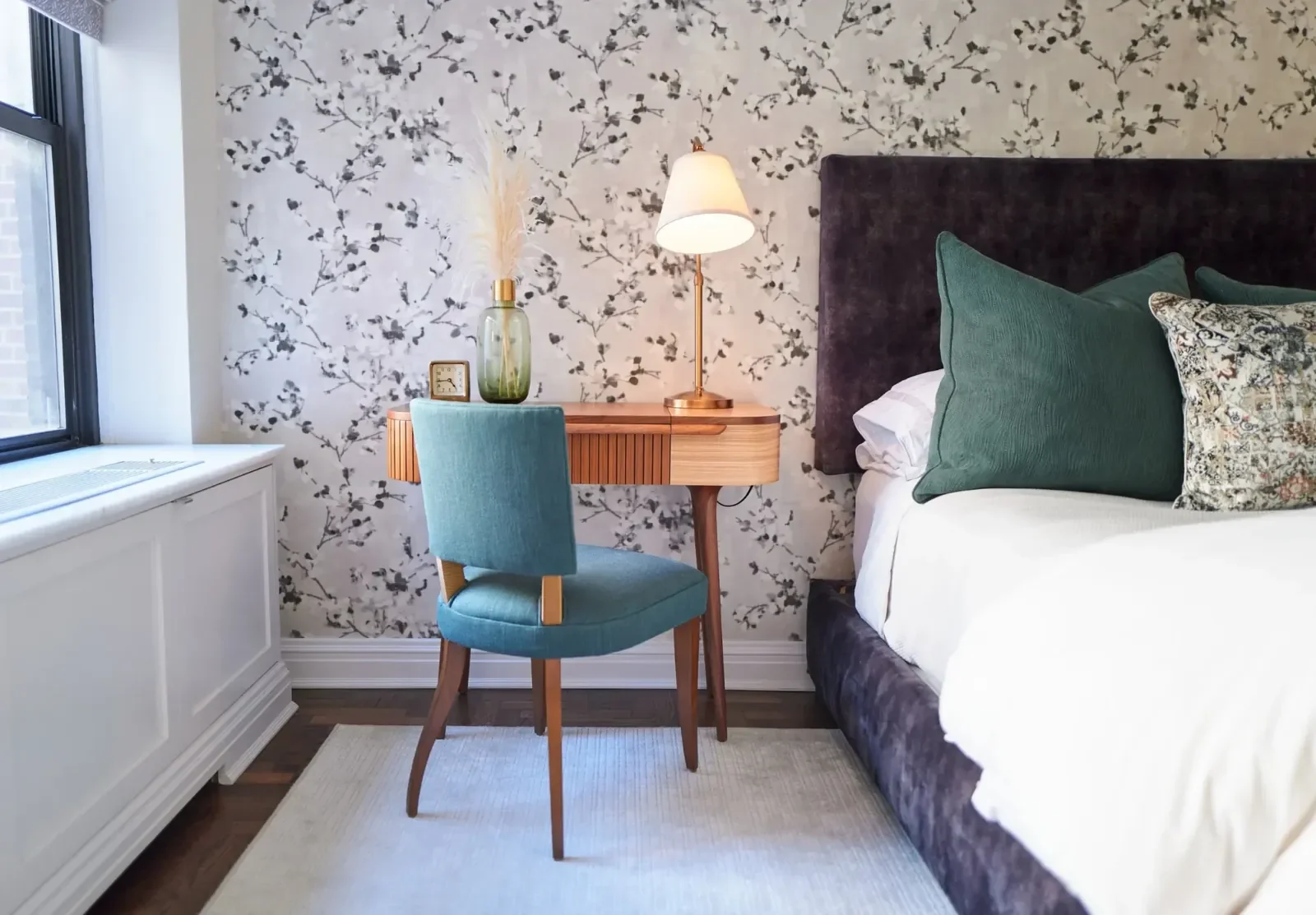 Floral wallpaper installation in a luxury residential bedroom.