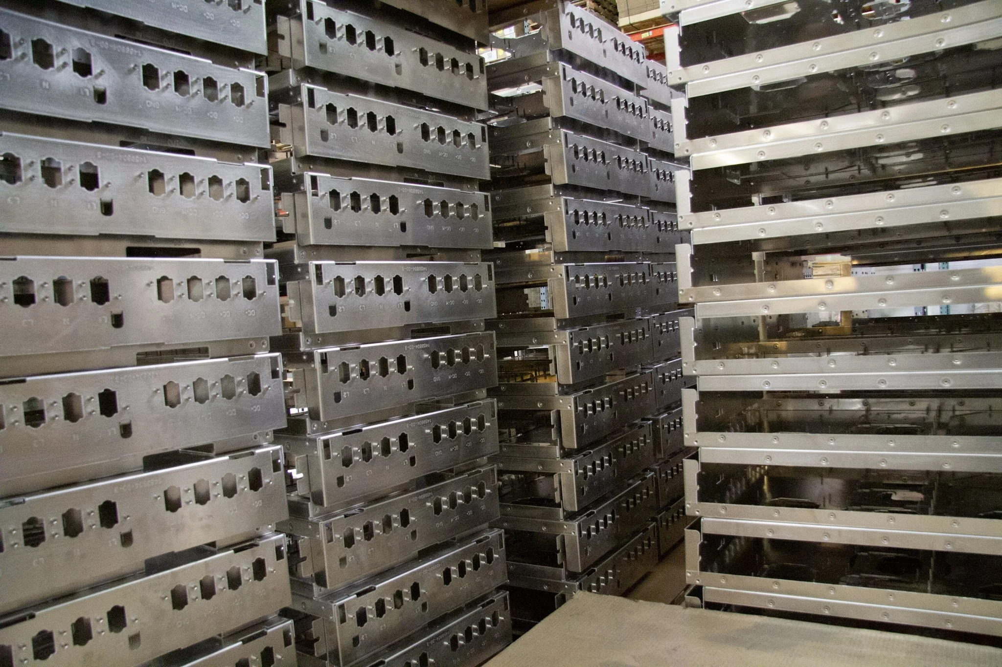 High-volume precision sheet metal parts ready for shipment – 7C’s Manufacturing