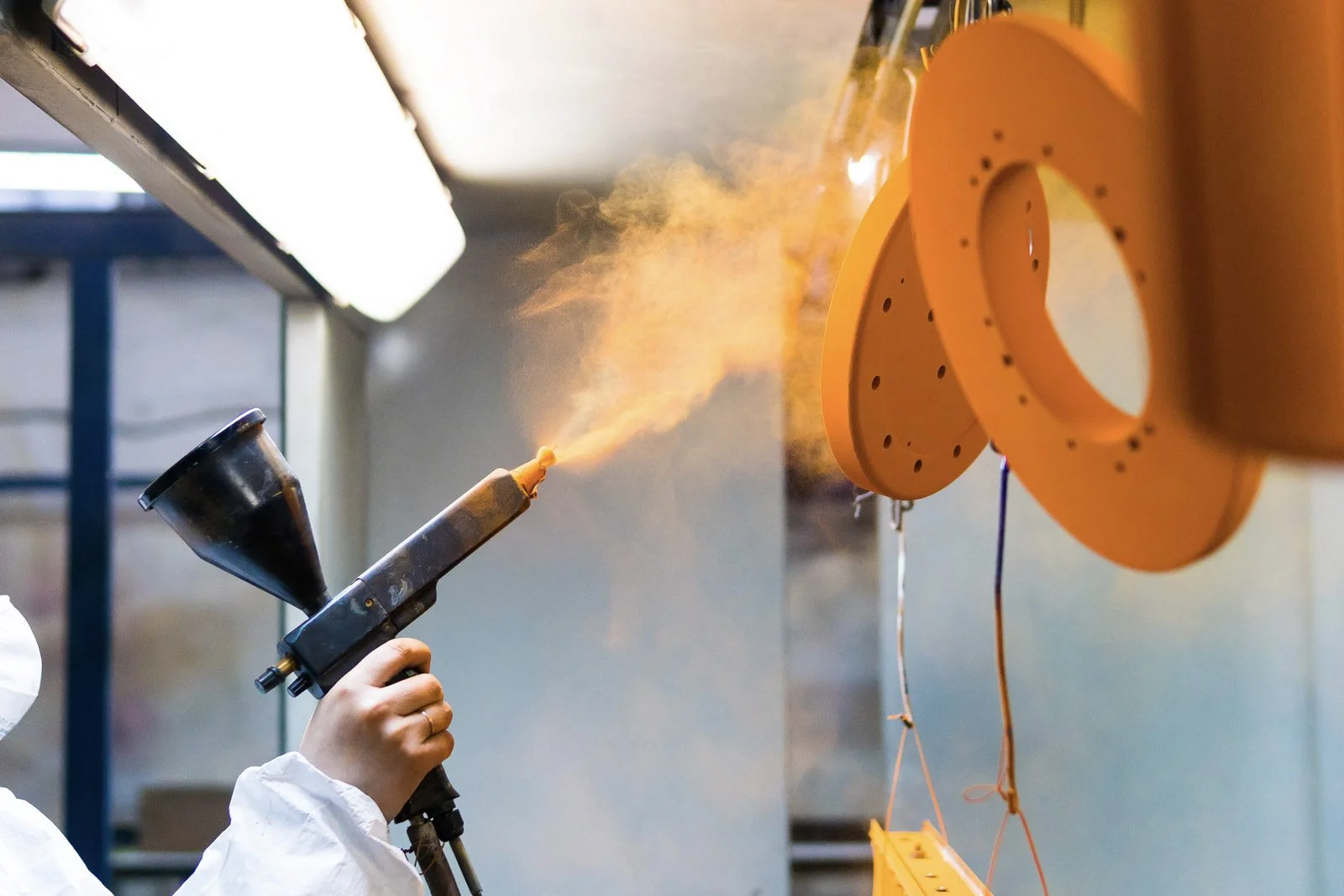 Professional powder coating finish on precision fabricated metal parts – 7C’s Manufacturing