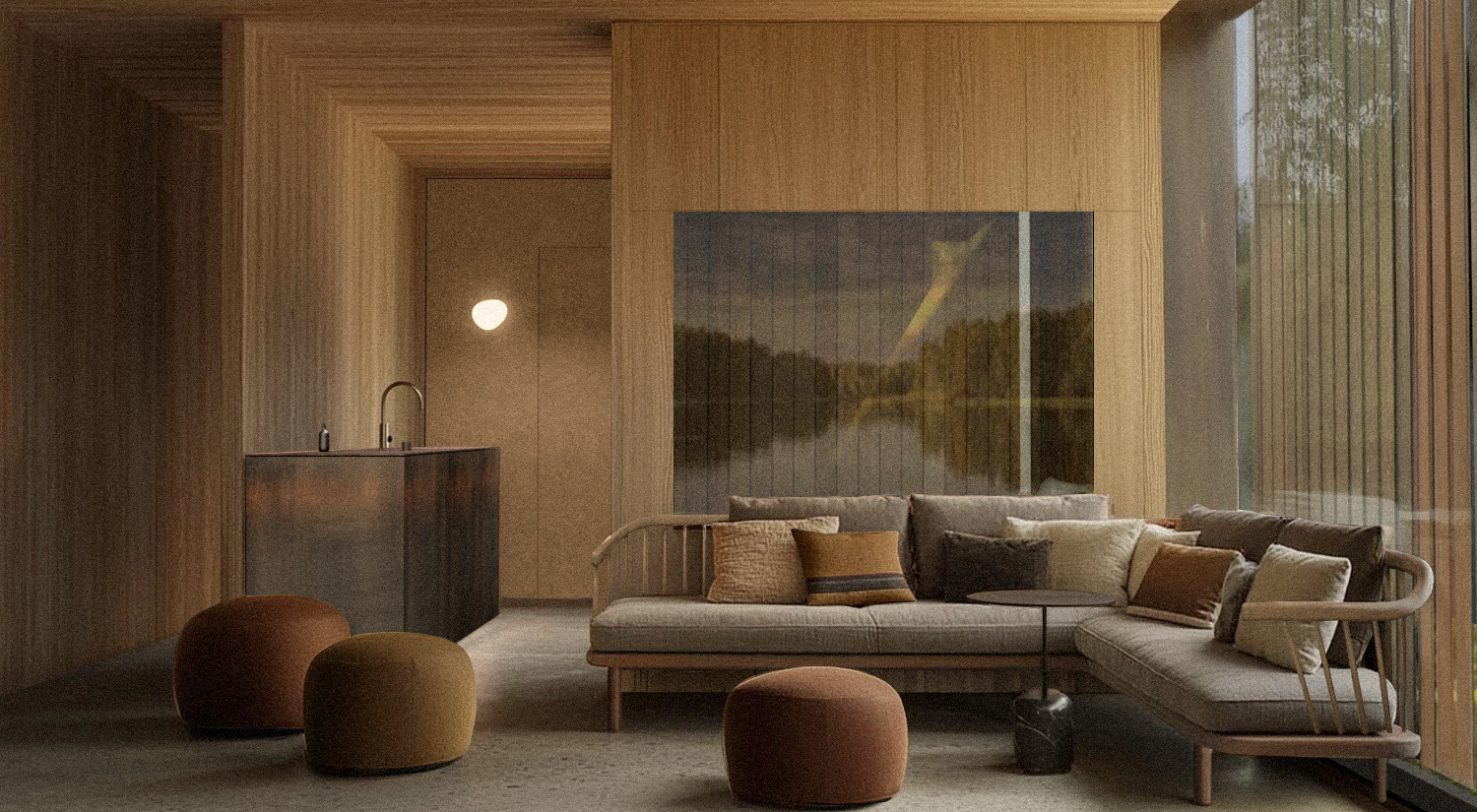 Salon moderne avec canapé en tissu gris, plusieurs coussins, mobilier en bois clair, grands murs en bois, grande fenêtre avec vue sur la nature, sol en tapis neutre, coin avec meuble en bois sombre et lavabo en métal, ambiance chaleureuse et minimaliste.