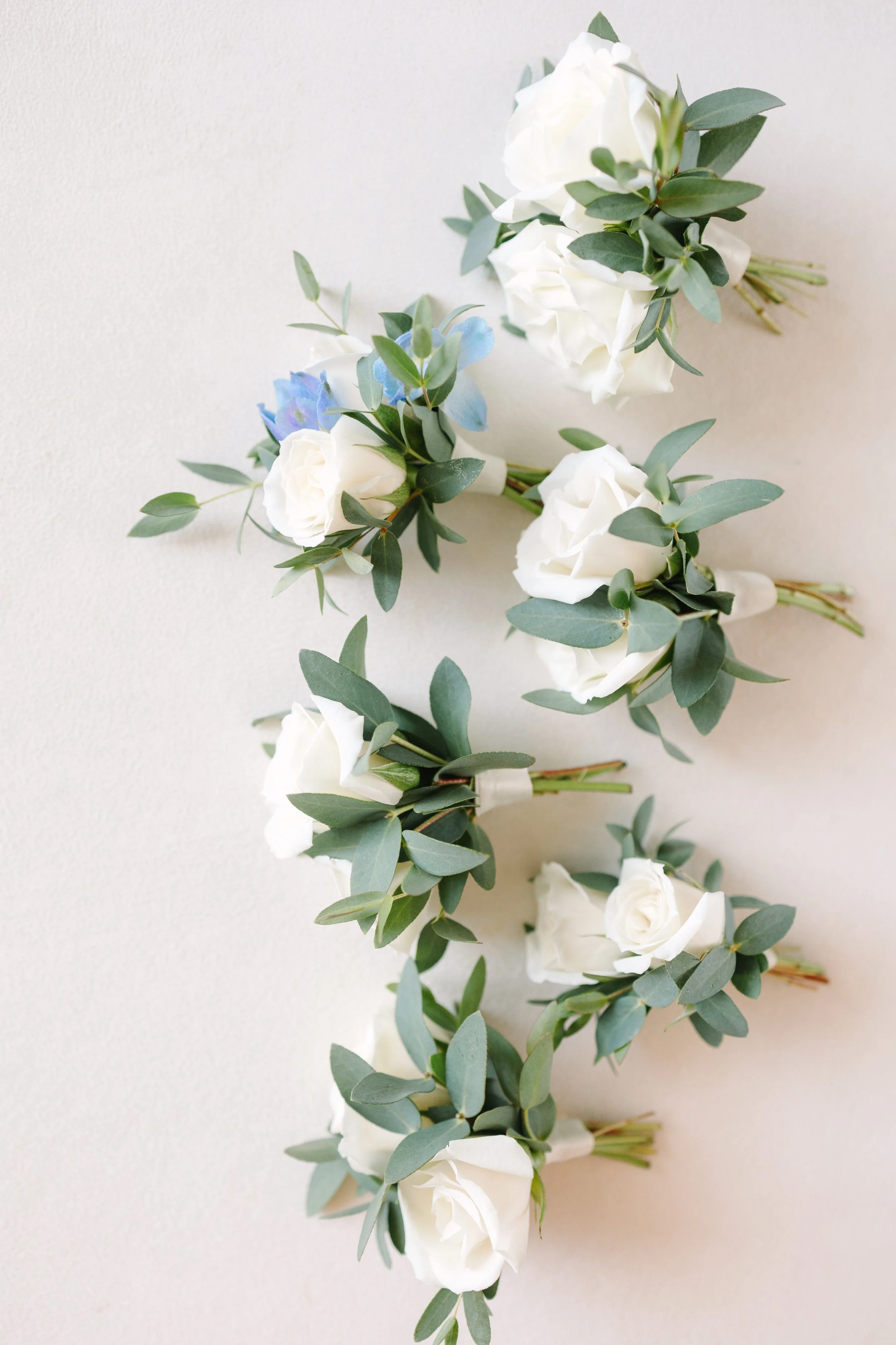 Floral arrangement with greenery and white blooms — wedding design by Gordon Duo Weddings