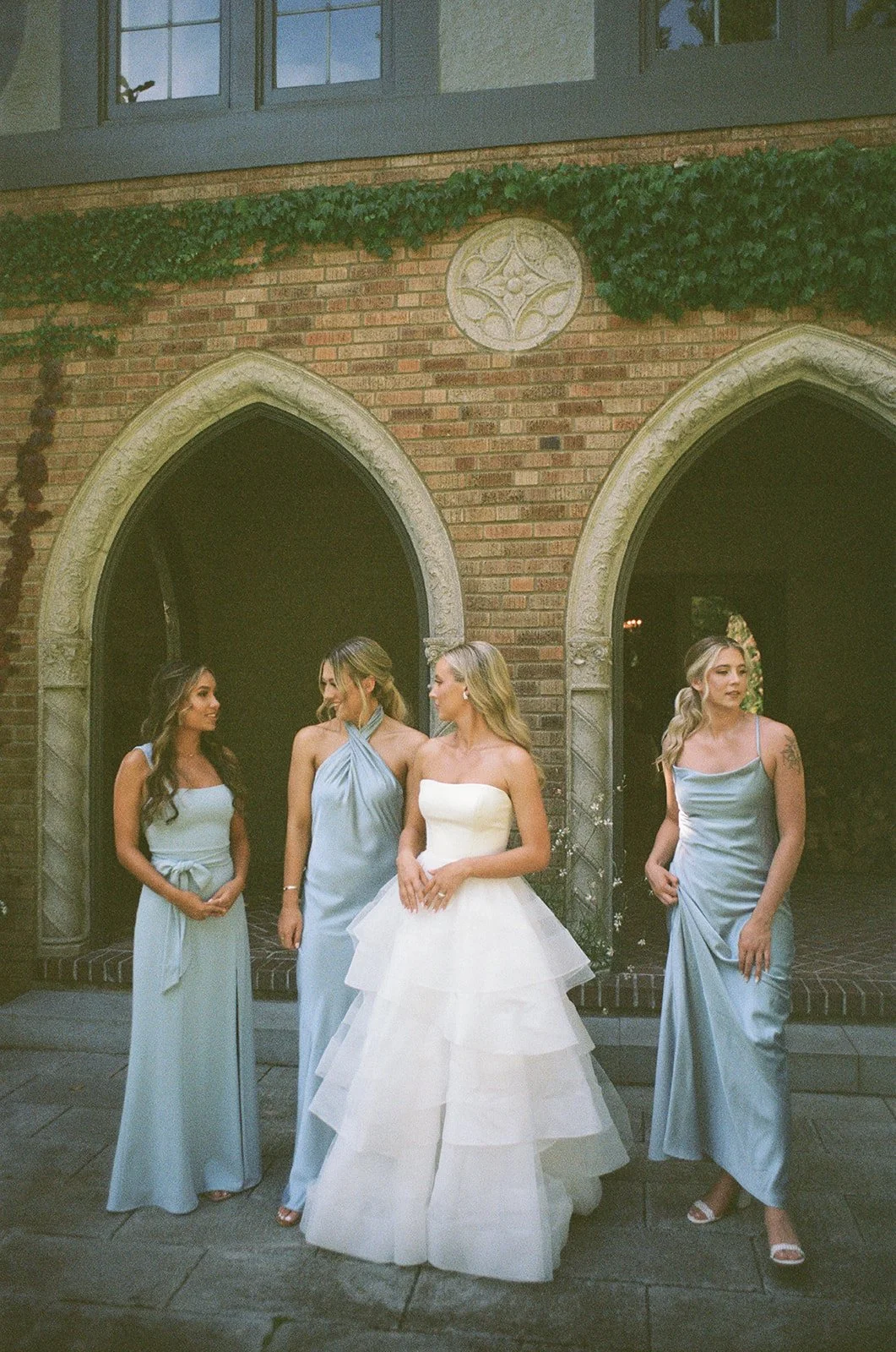 Bridesmaids in blue dresses at The Highlands Shoreline — wedding planned by Gordon Duo Weddings
