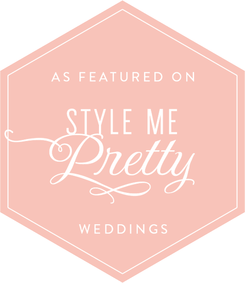 A pink hexagonal badge with white text that says: 'As featured on Style Me Pretty Weddings'.