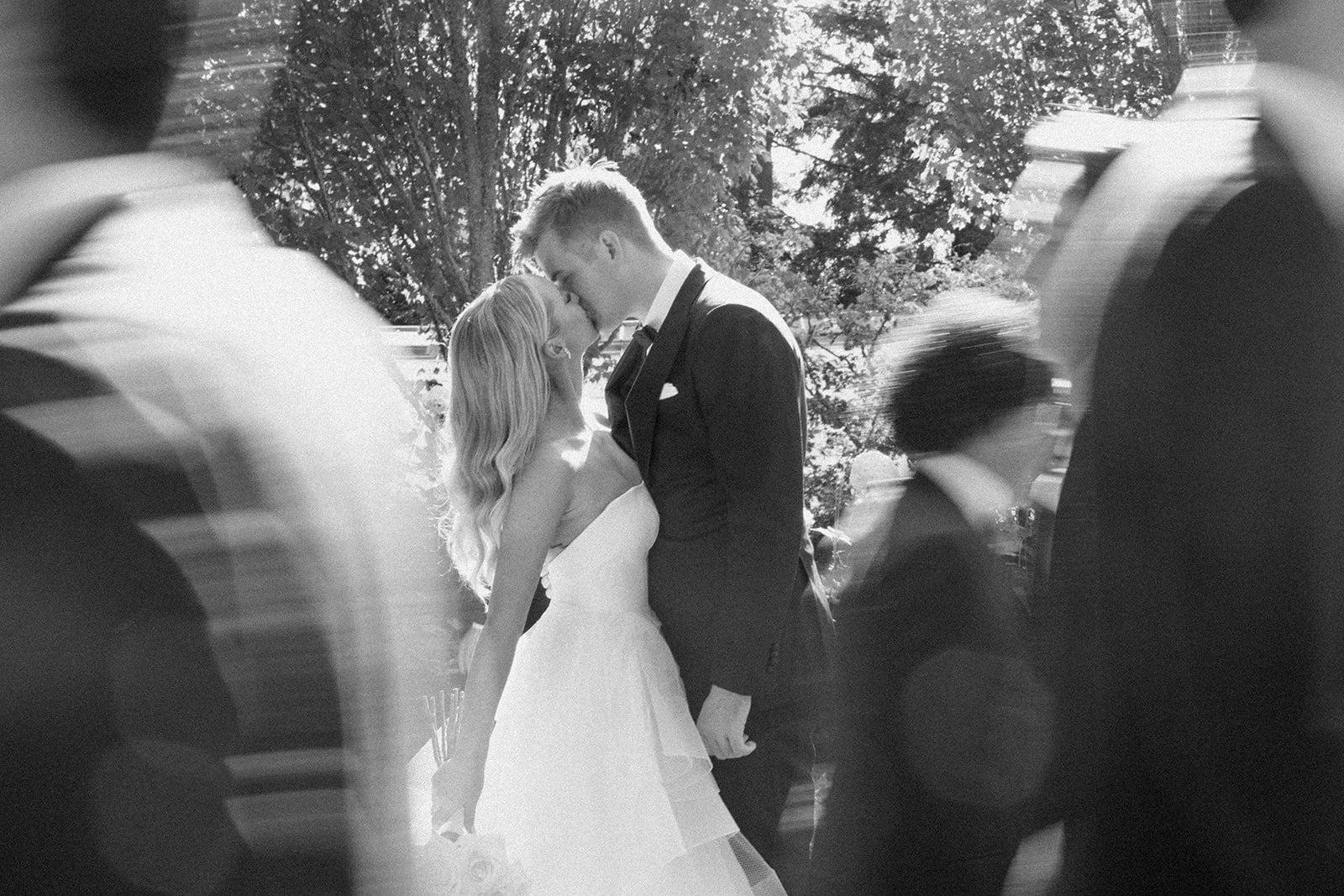 Bride and groom sharing a kiss at a private home residence in Shoreline, WA — photo by Nicole Gange Photography