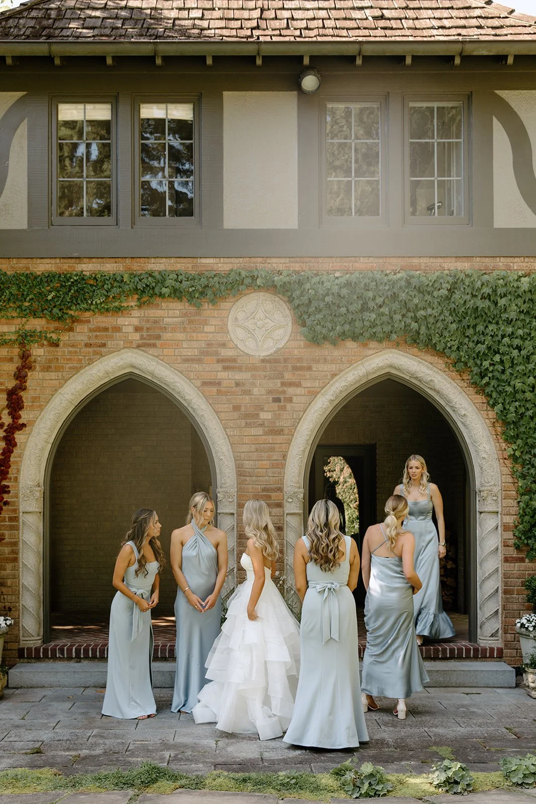Bridesmaids in blue dresses at The Highlands Shoreline — wedding planned by Gordon Duo Weddings