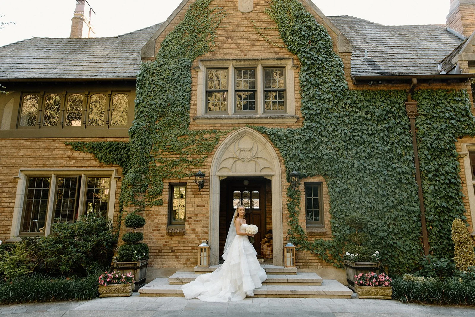 Ivy covered stone estate entrance at The Highlands Shoreline WA — wedding planned by Gordon Duo Weddings