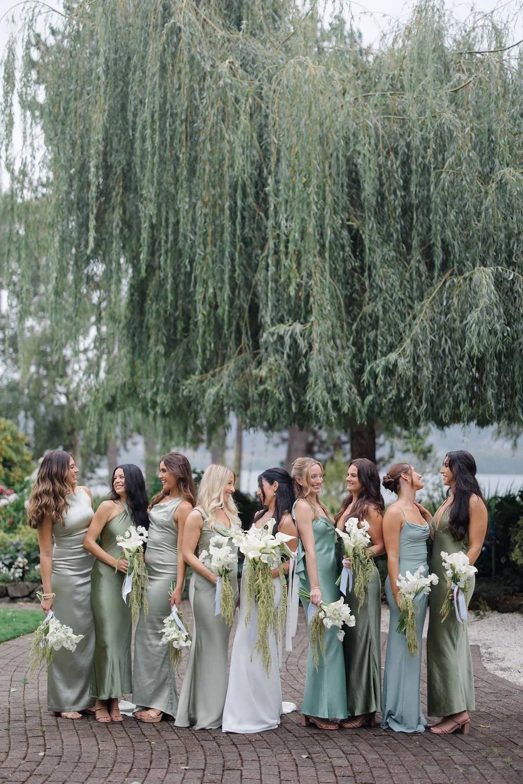 Bridesmaids in sage green dresses at Kiana Lodge — wedding planned by Gordon Duo Weddings