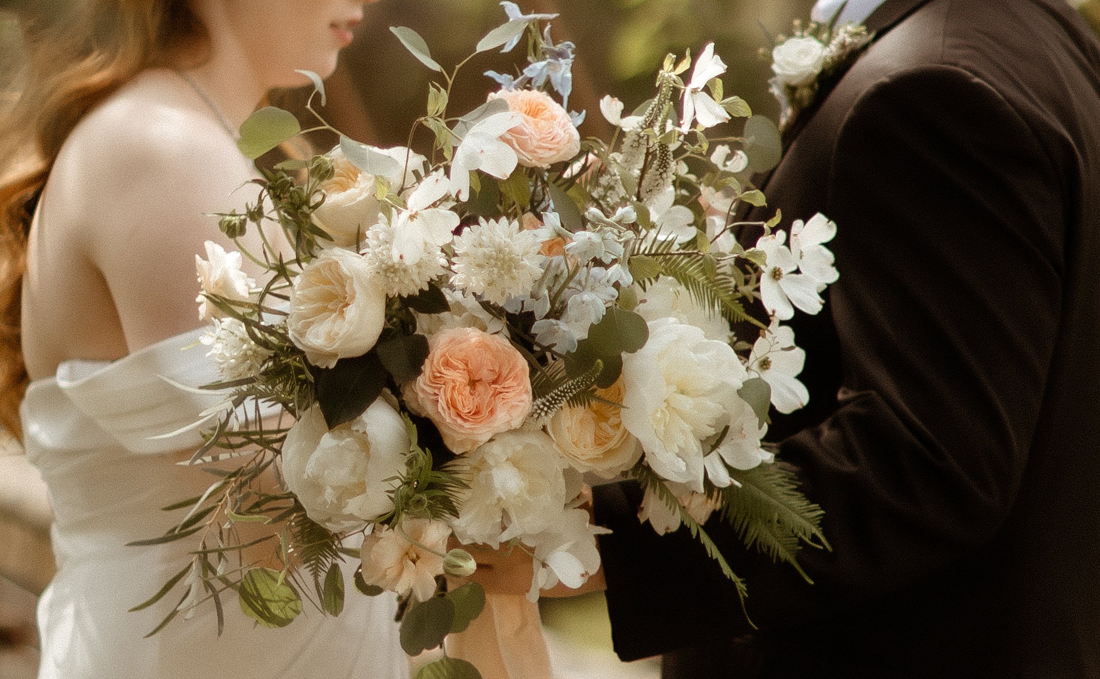 Close-up of wedding florals at Outlook Inn on Orcas Island, WA — photo by Ashley Hillstead Photography