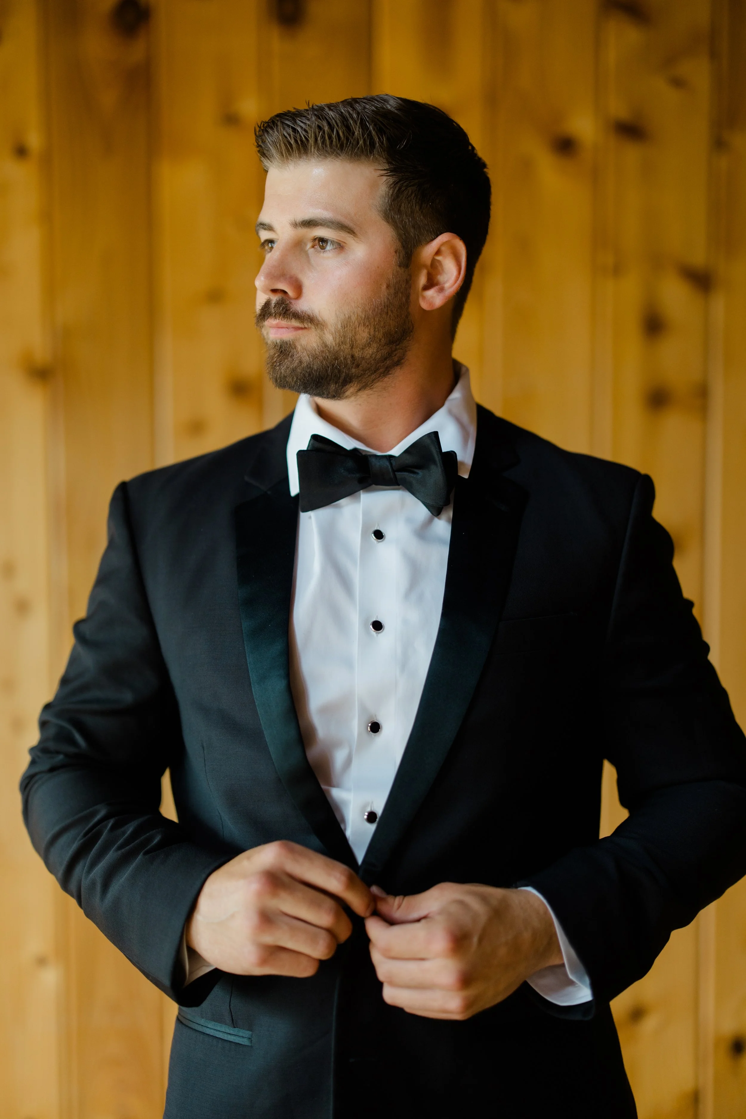Groom in tuxedo getting ready at Kiana Lodge — wedding planned by Gordon Duo Weddings