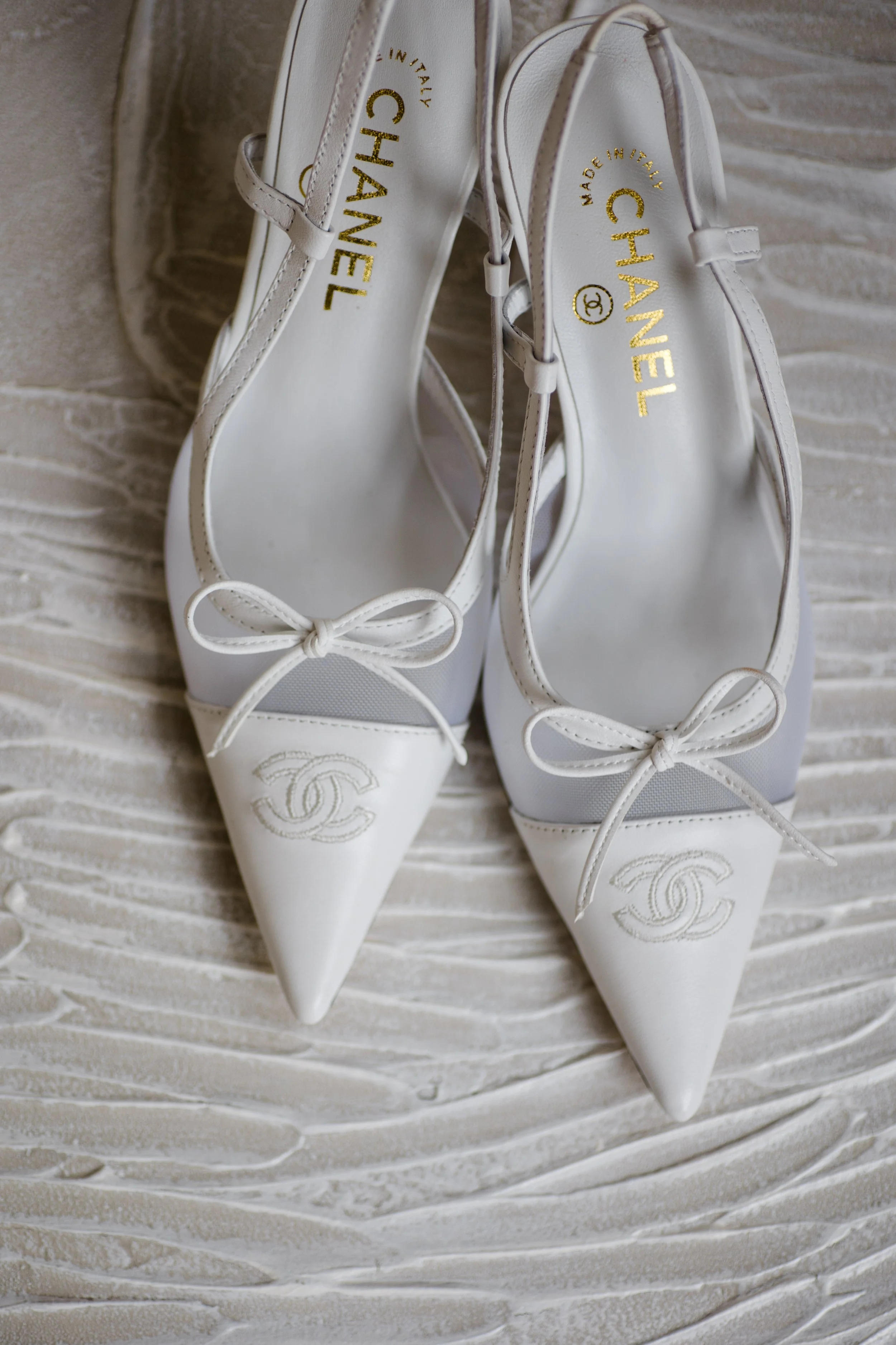 Chanel bridal heels detail — Kate and Charlie's wedding at Kiana Lodge, planned by Gordon Duo Weddings
