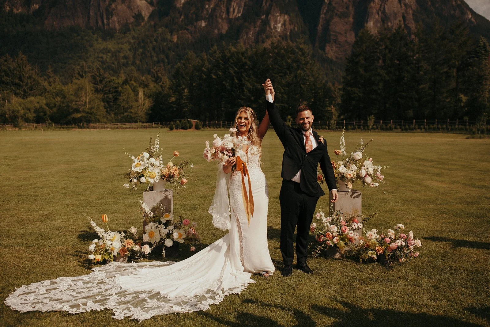 Bride and groom celebrating outdoors at Northfork Farm Events, Snoqualamie WA — photo by Jordan Voth, Gordon Duo Weddings