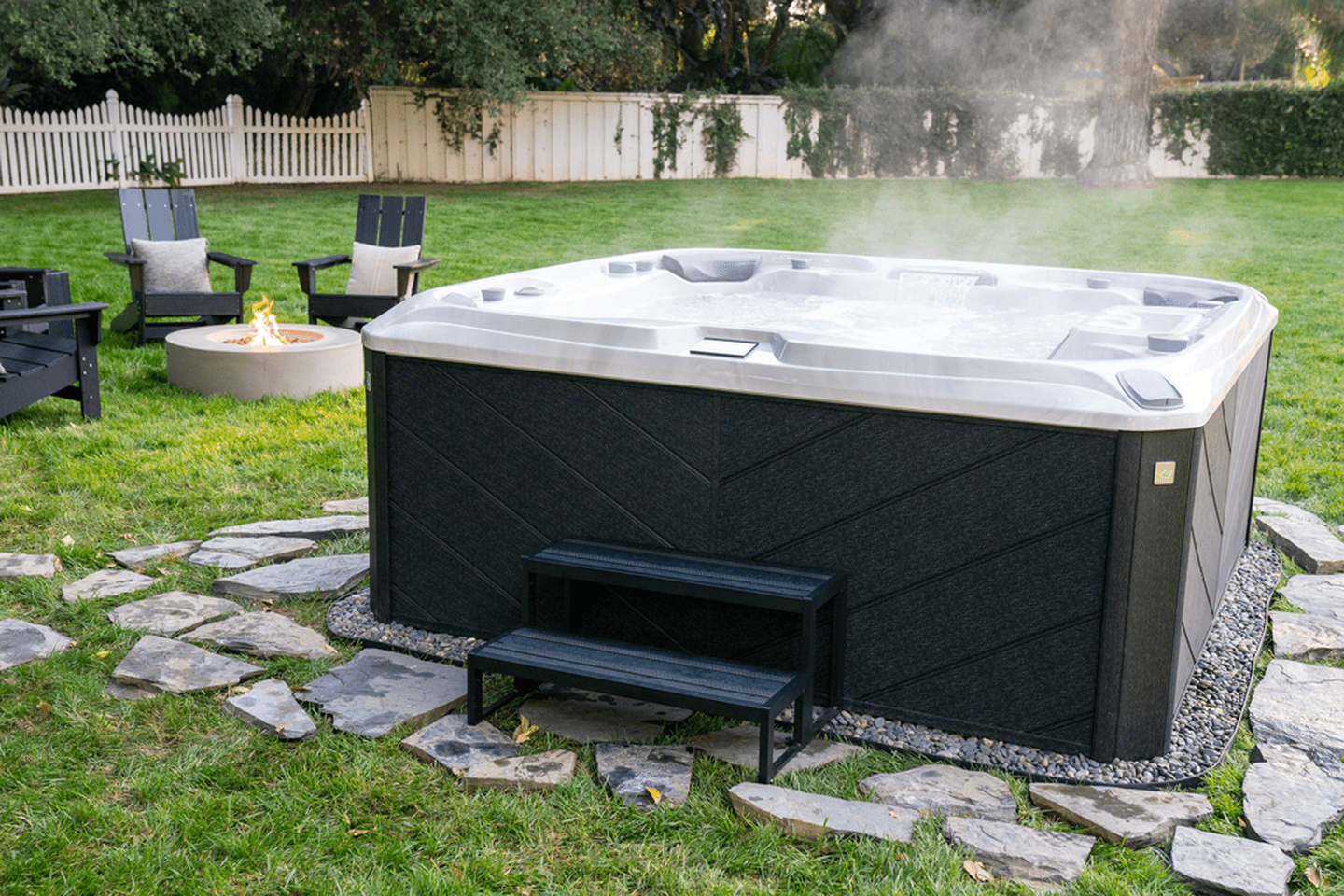 Outdoor backyard with a hot tub. Sundance 880 Series Optima. .