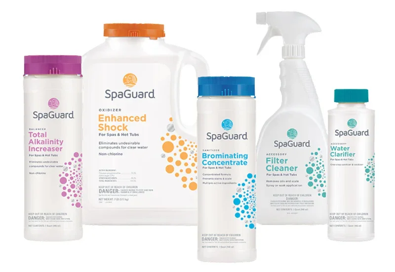 Collection of SpaGuard pool care products including alkalinity increaser, water clarifier, brominating concentrate, filter cleaner, enhanced shock, and a large bottle of oxidizer.