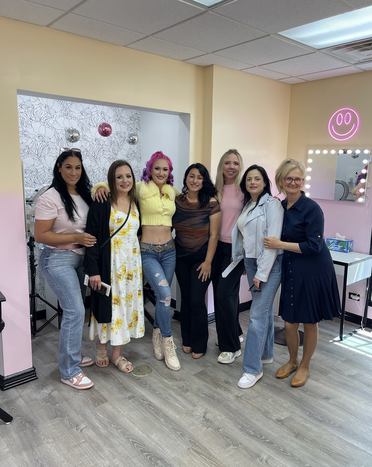 Group of female makeup artists posing for makeup certification
