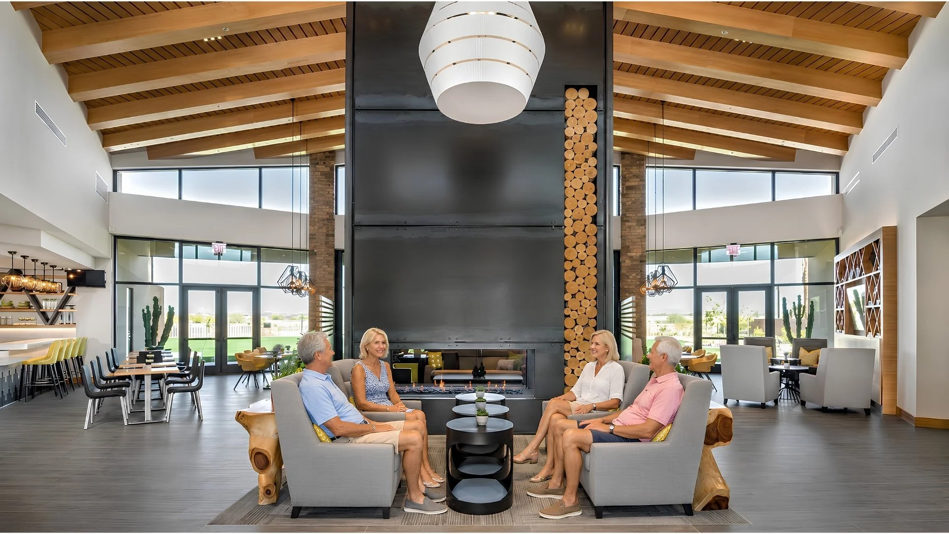 Residents gathering inside the modern Encore at Eastmark clubhouse in Mesa, Arizona.