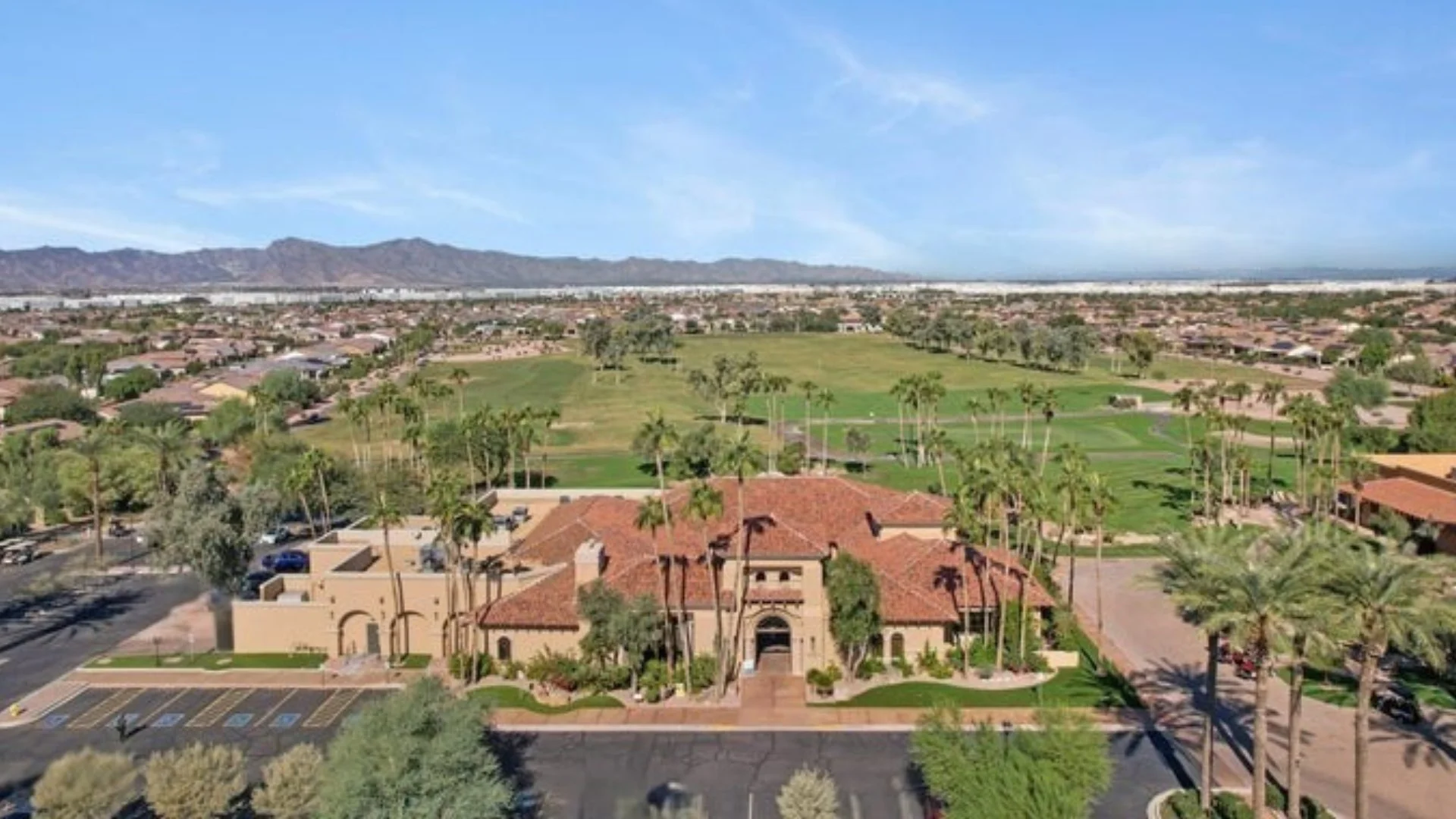 Aerial view of the PebbleCreek clubhouse and golf course in Goodyear, Arizona.