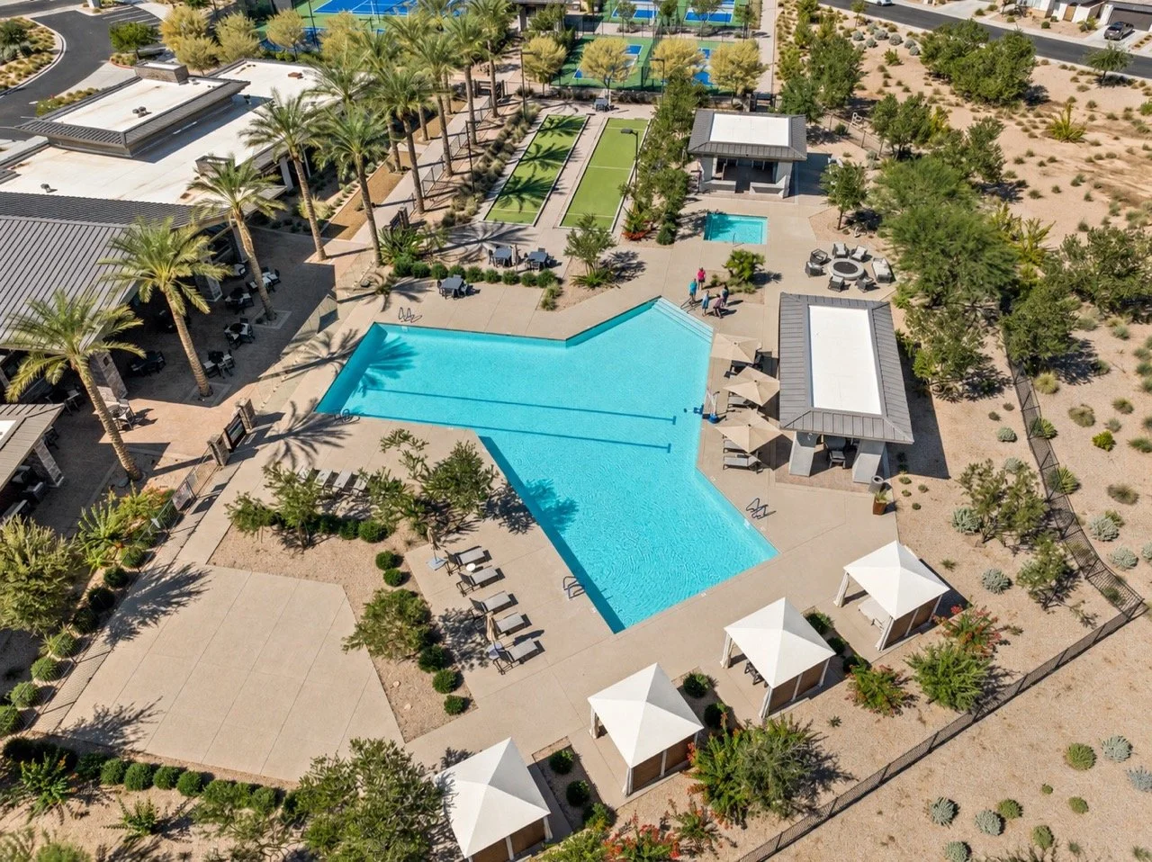 Resort-style pool, private cabanas, and bocce courts at Ovation at Meridian in Queen Creek, Arizona.