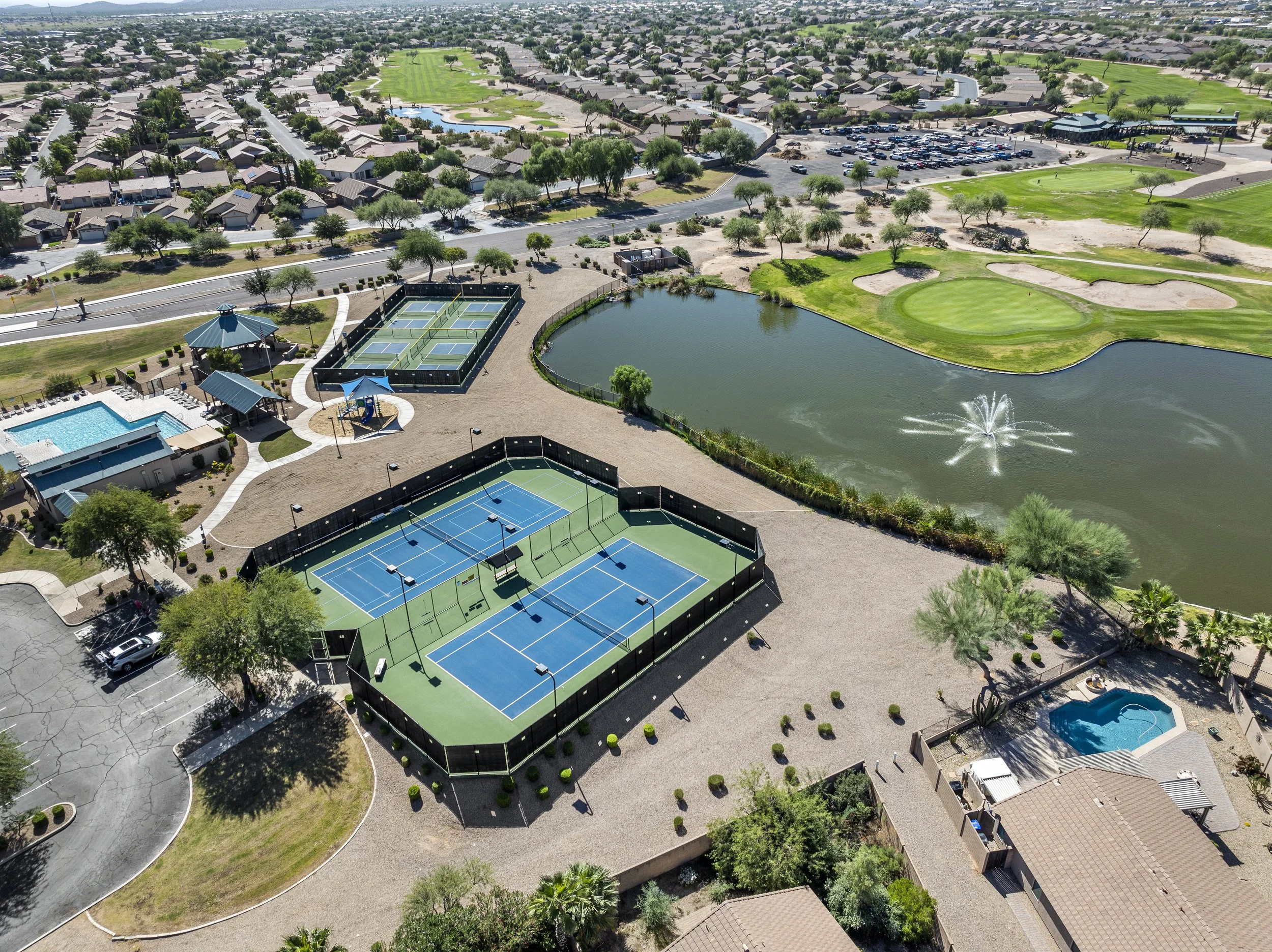 Aerial view of Johnson Ranch pickleball and tennis courts, community pool, and amenities available to Solera Johnson Ranch residents.