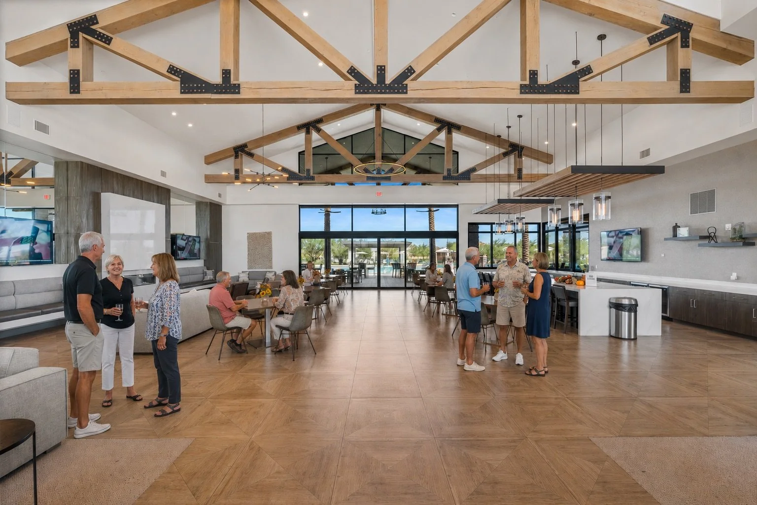 Residents gathering inside the modern clubhouse at Ovation at Meridian in Queen Creek, Arizona.