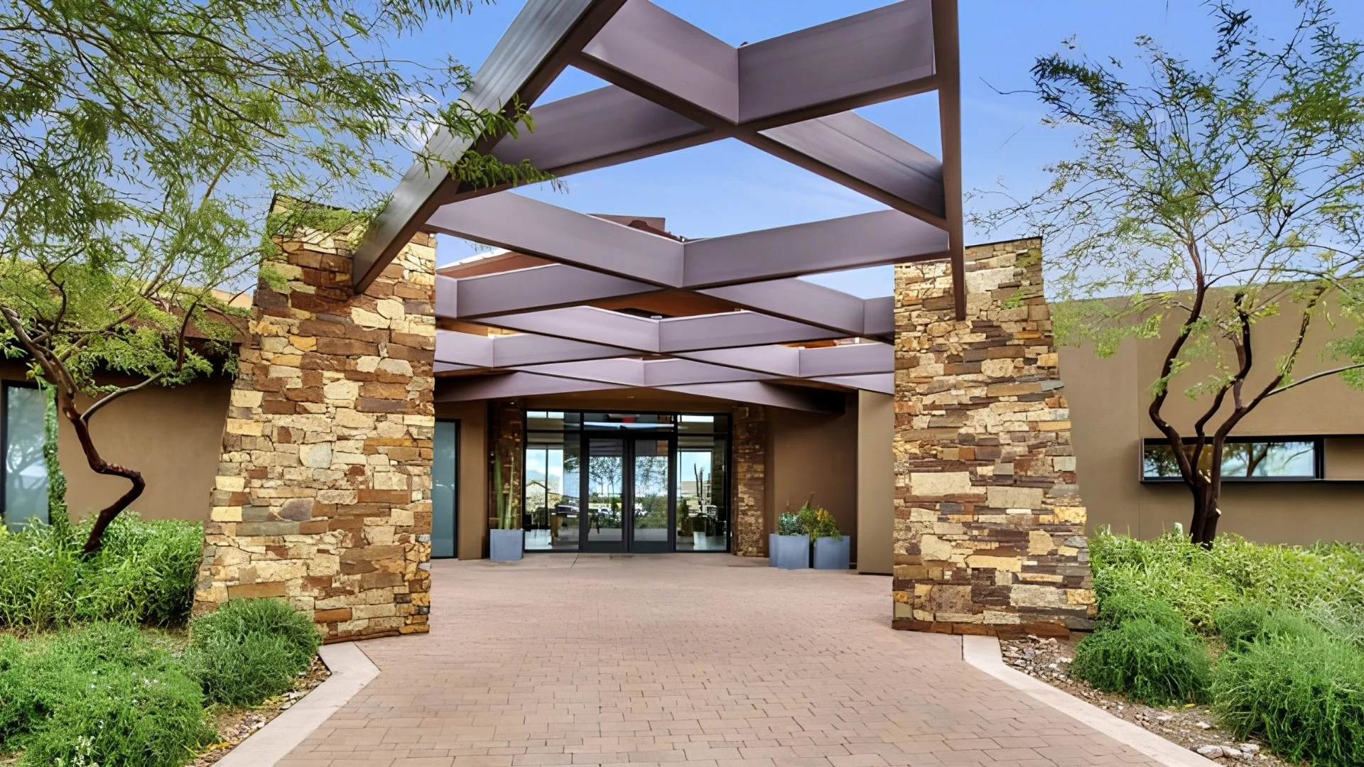 Modern clubhouse entrance at Encore at Eastmark, a 55+ active adult community in Mesa, Arizona.