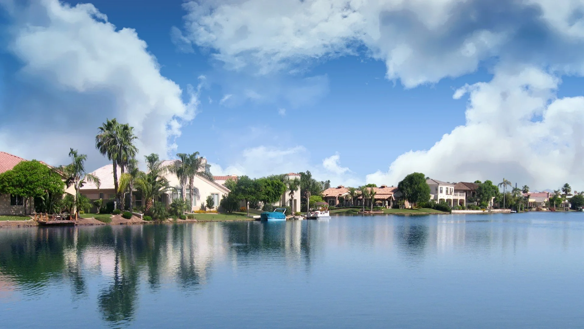 Lakefront living and palm lined waterfront home in Val Vista Lakes, Gilbert, Arizona.