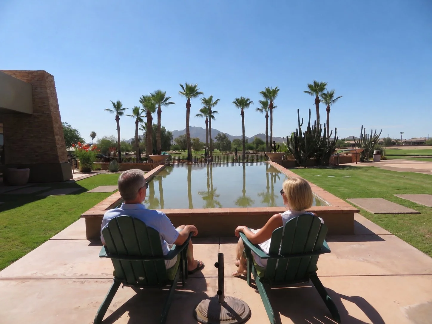 Residents relaxing beside the reflection pool at Solera Chandler in Chandler, Arizona.