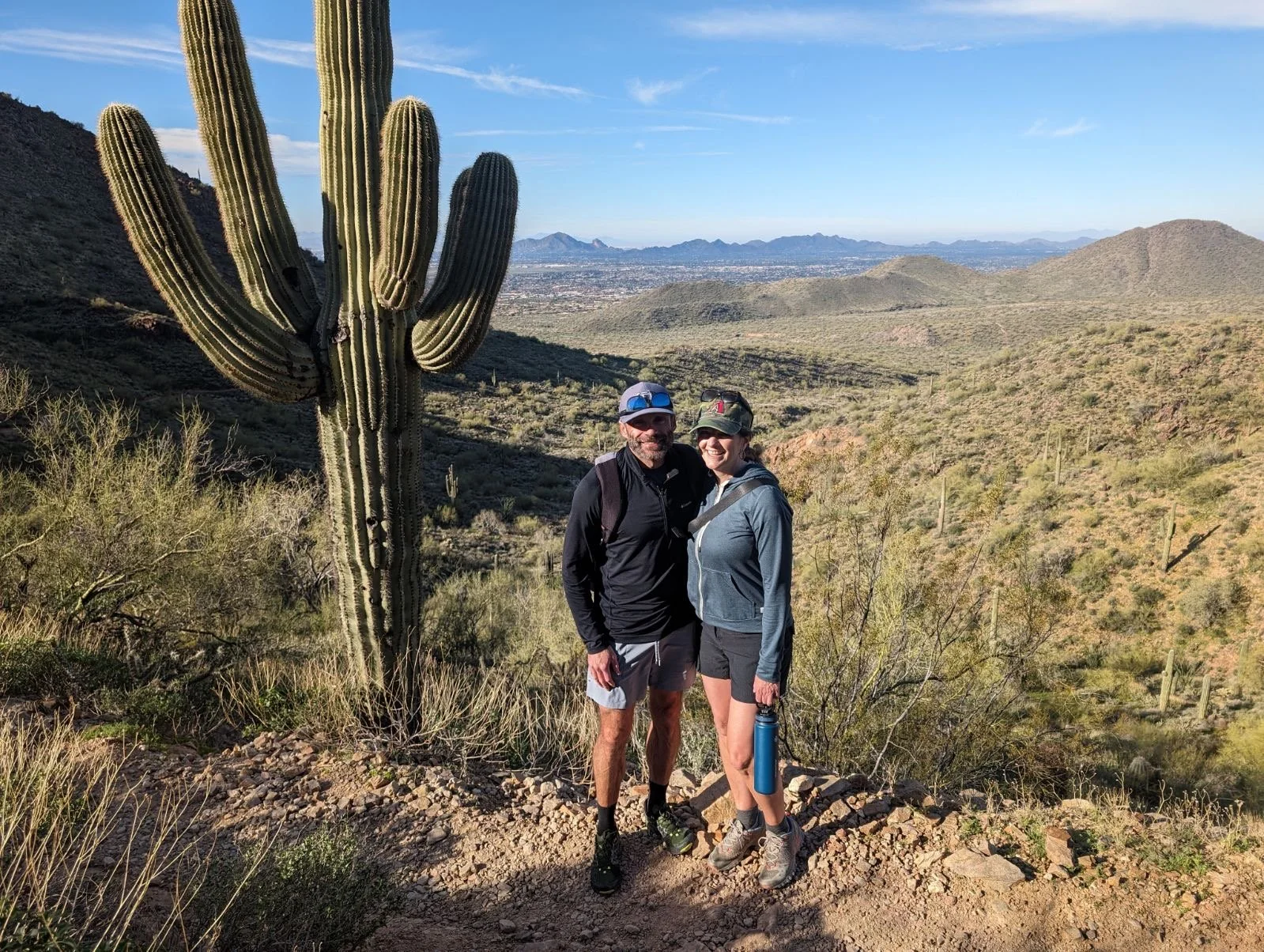 Hikers on Sunrise Trail a popular, moderately challenging 4-mile out-and-back hike located in the McDowell Sonoran Preserve in Scottsdale, Arizona.